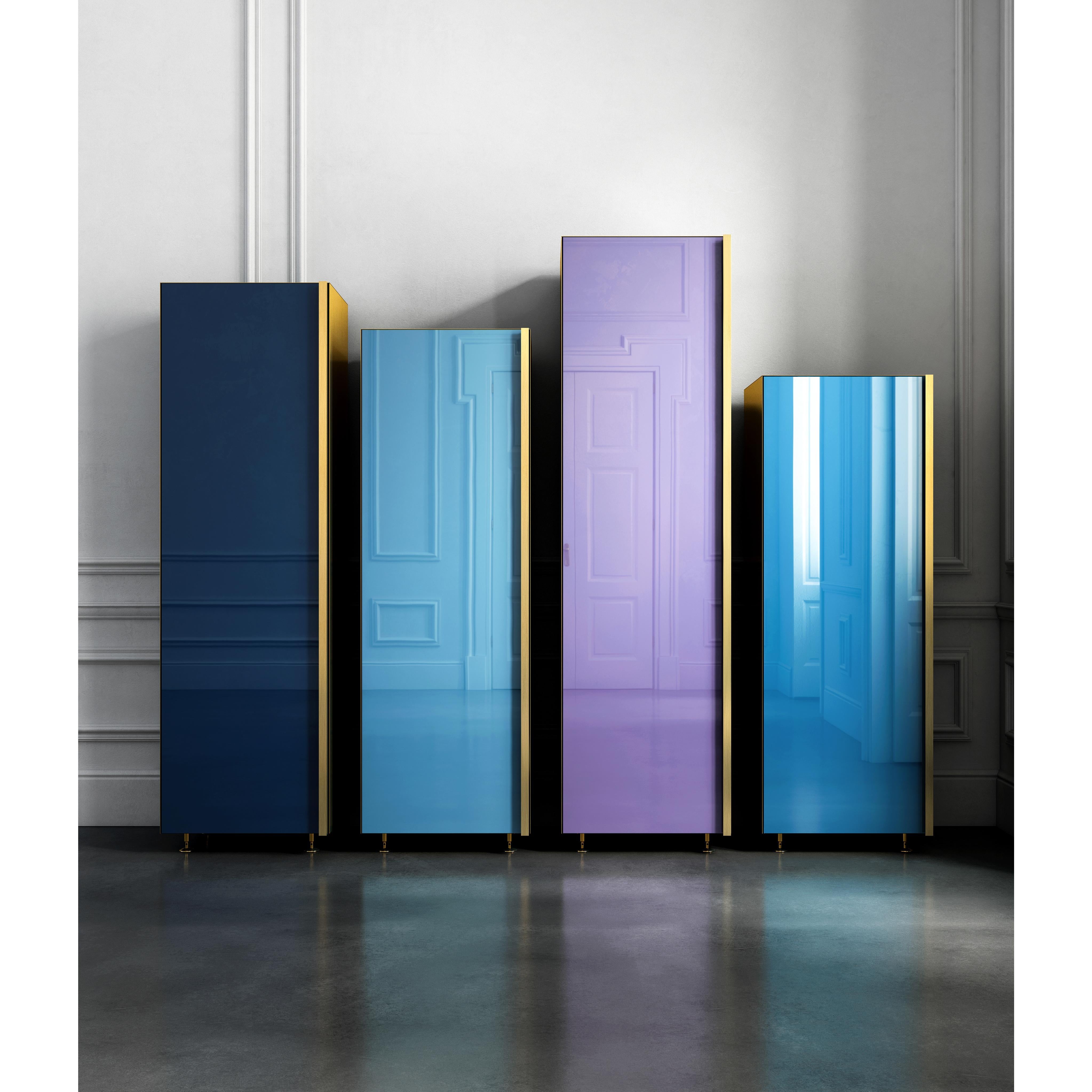 Column Set 01
Set of four separate containers with different heights. Back-painted glass door colored in blue tones, lacquered wooden interior and full height brass handle and sides. The four elements can be placed in any interior environment as
