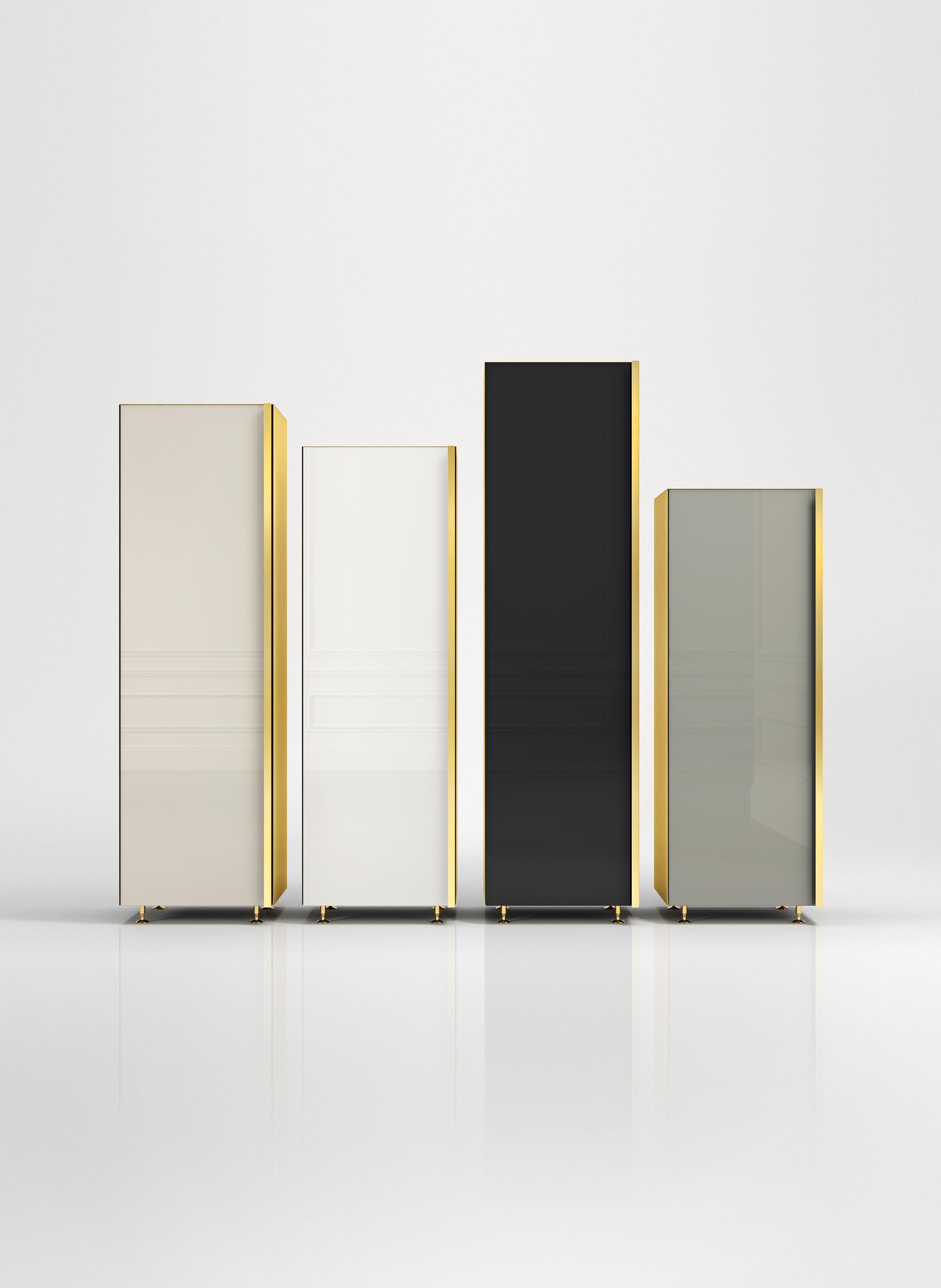 Column Set 01
Set of four separate containers with different heights. Back-painted glass door colored in neutral tones, lacquered wooden interior and full height brass handle and sides. The four elements can be placed in any interior environment as