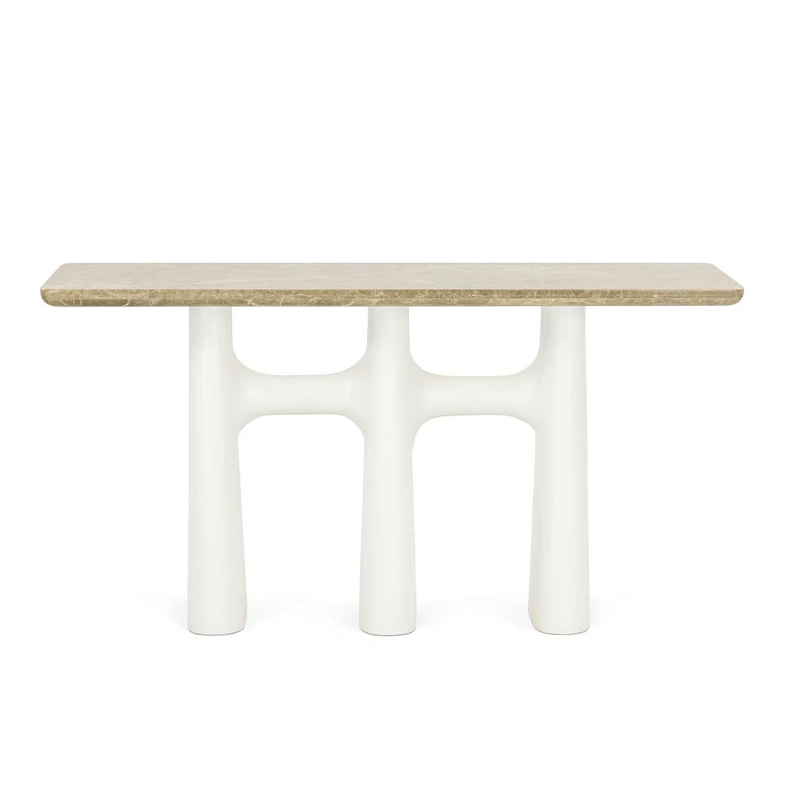 This elegant console features a marble tabletop with veins of brown, cream, and gold. The tabletop rests on three organic-shaped, creamy white plaster legs with a slightly textured surface. The legs curve inwards at the bottom, adding a touch of
