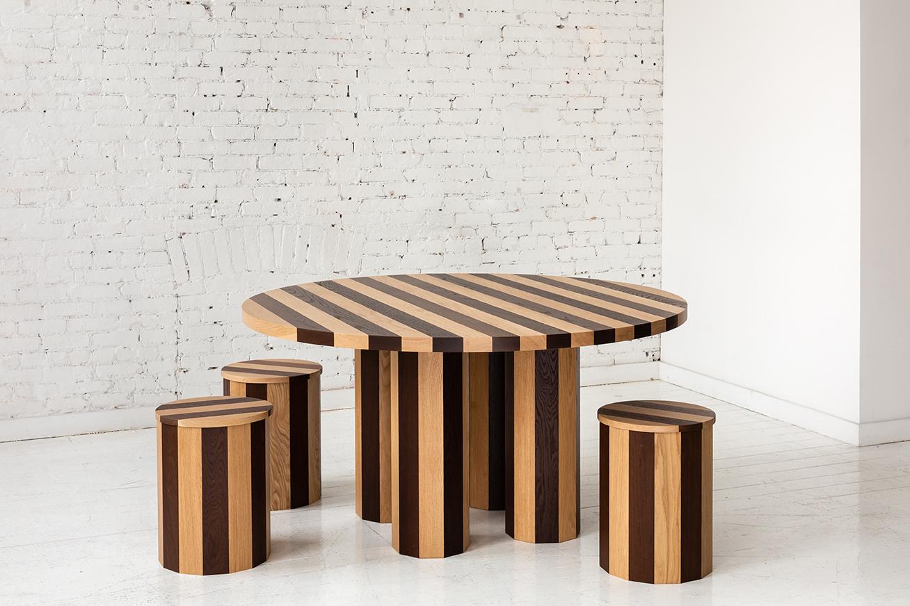 This stool is a part of the new Cooperage Dining collection. Each piece features large faceted round elements that with its namesake reference the traditional cooper's trade of making barrels.

The stool is shown in a bold palette of contrasting