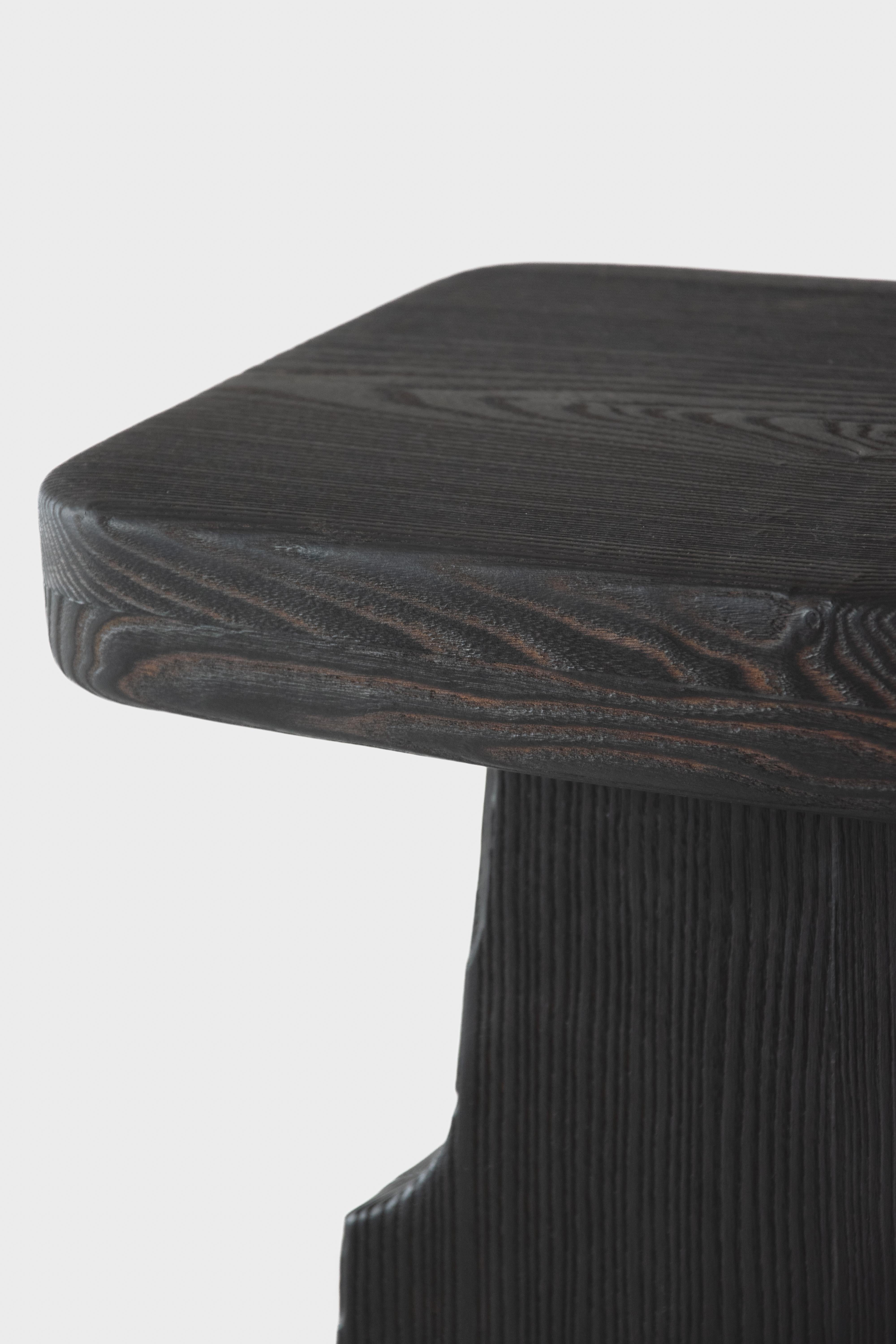 THARO Counter Stool by German contemporary design studio Eichkorn. 
Material: Burnt Ash Wood
Standard size: H.65 x 35 cm - Customizations are possible

Crafted from burnt ash wood - our bar / counter stool „THARO“ .With its elegant, timeless design,