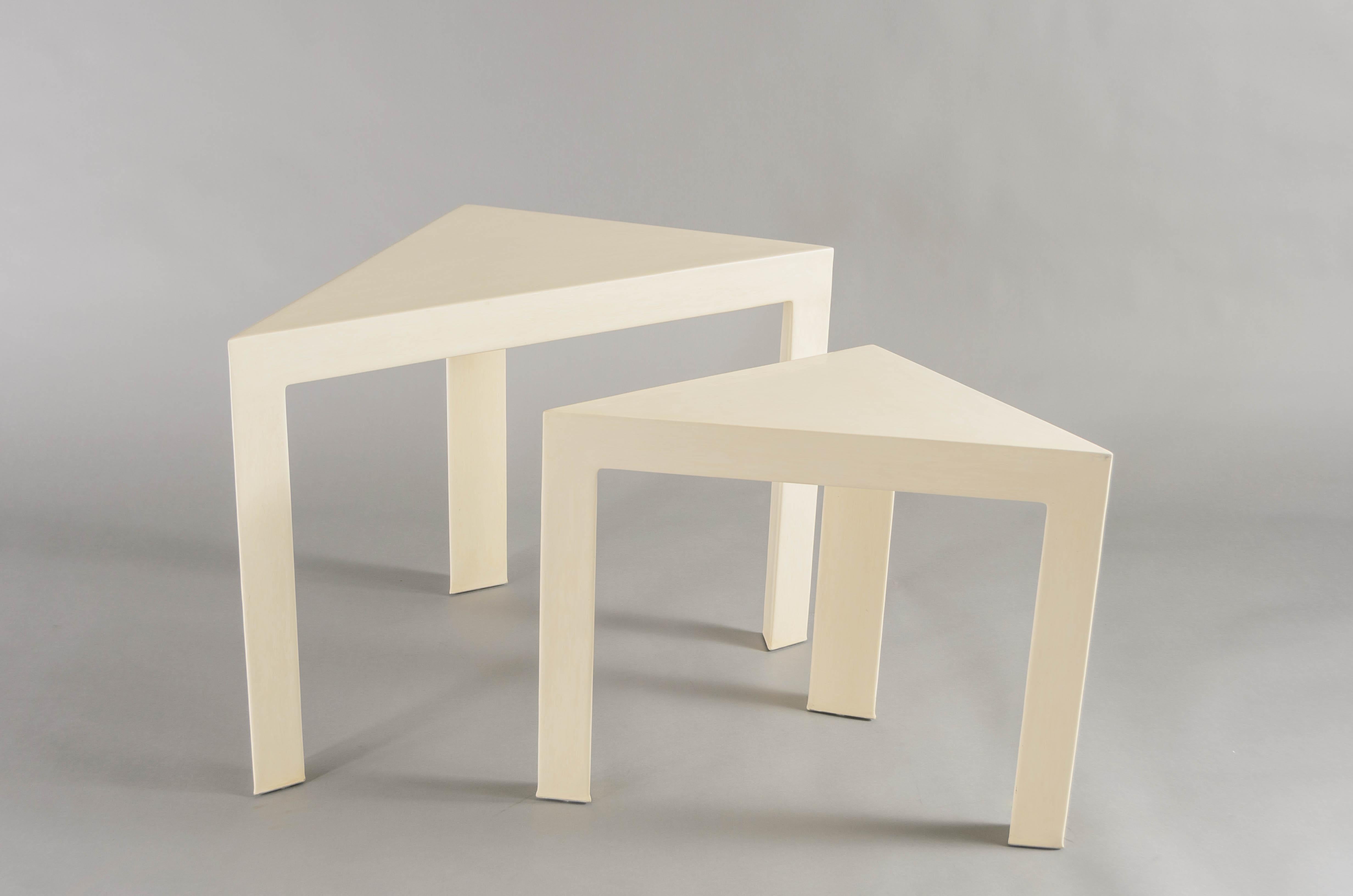Corner nesting tables - Set of 2
Cream Lacquer
Wood base
Hand made
Limited edition

Lacquer is a technique that dates back to the Shang dynasty, circa 1600-1100 B.C. These pieces are made with at least 60 coats of organic lacquer. Each layer