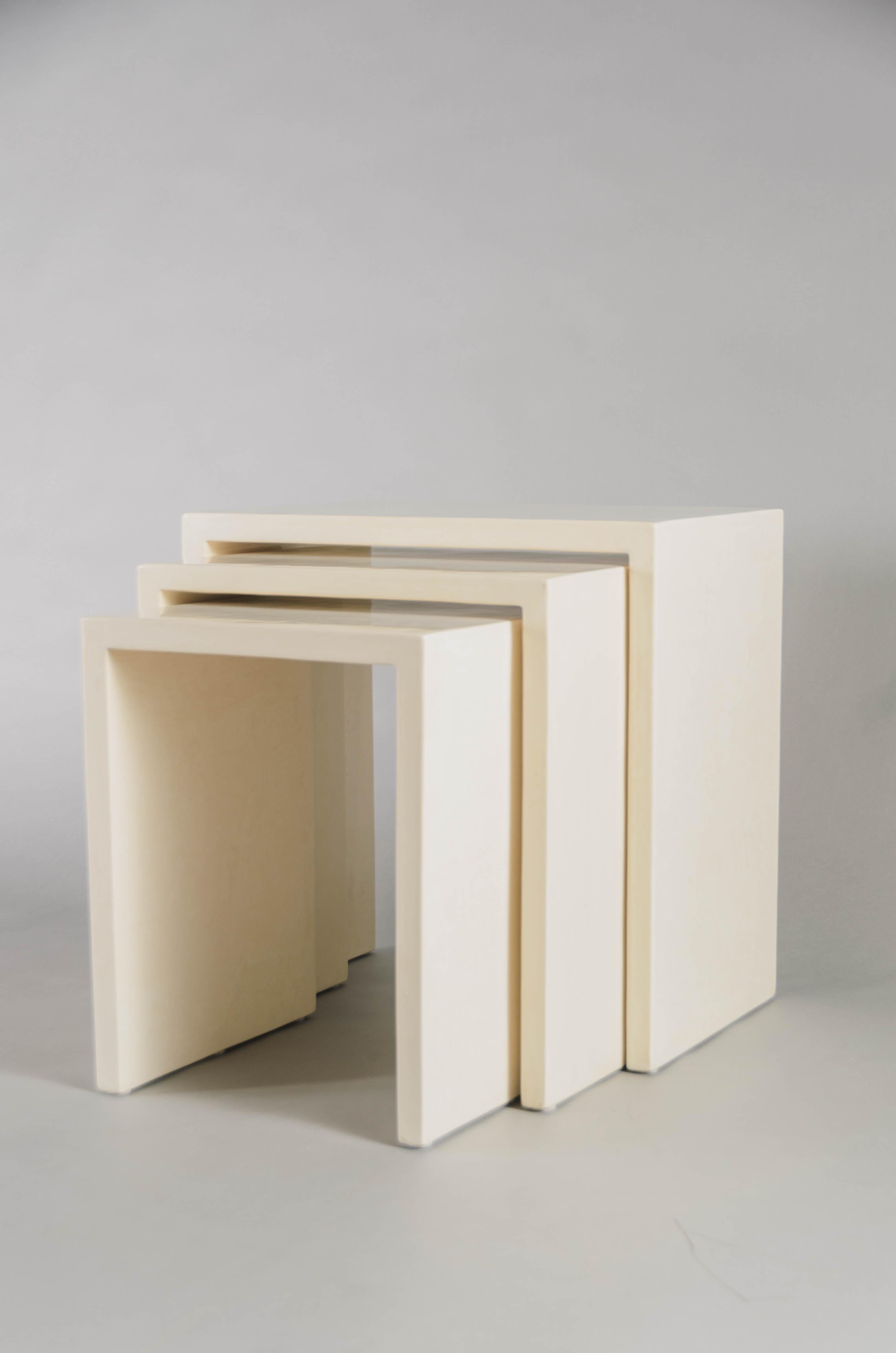 Square Corner nesting tables
Cream Lacquer
Wood base
Hand made 
Limited edition
Contemporary 

Lacquer is a technique that dates back to the Shang dynasty, circa 1600-1100 B.C. These pieces are made with at least 60 coats of organic lacquer.