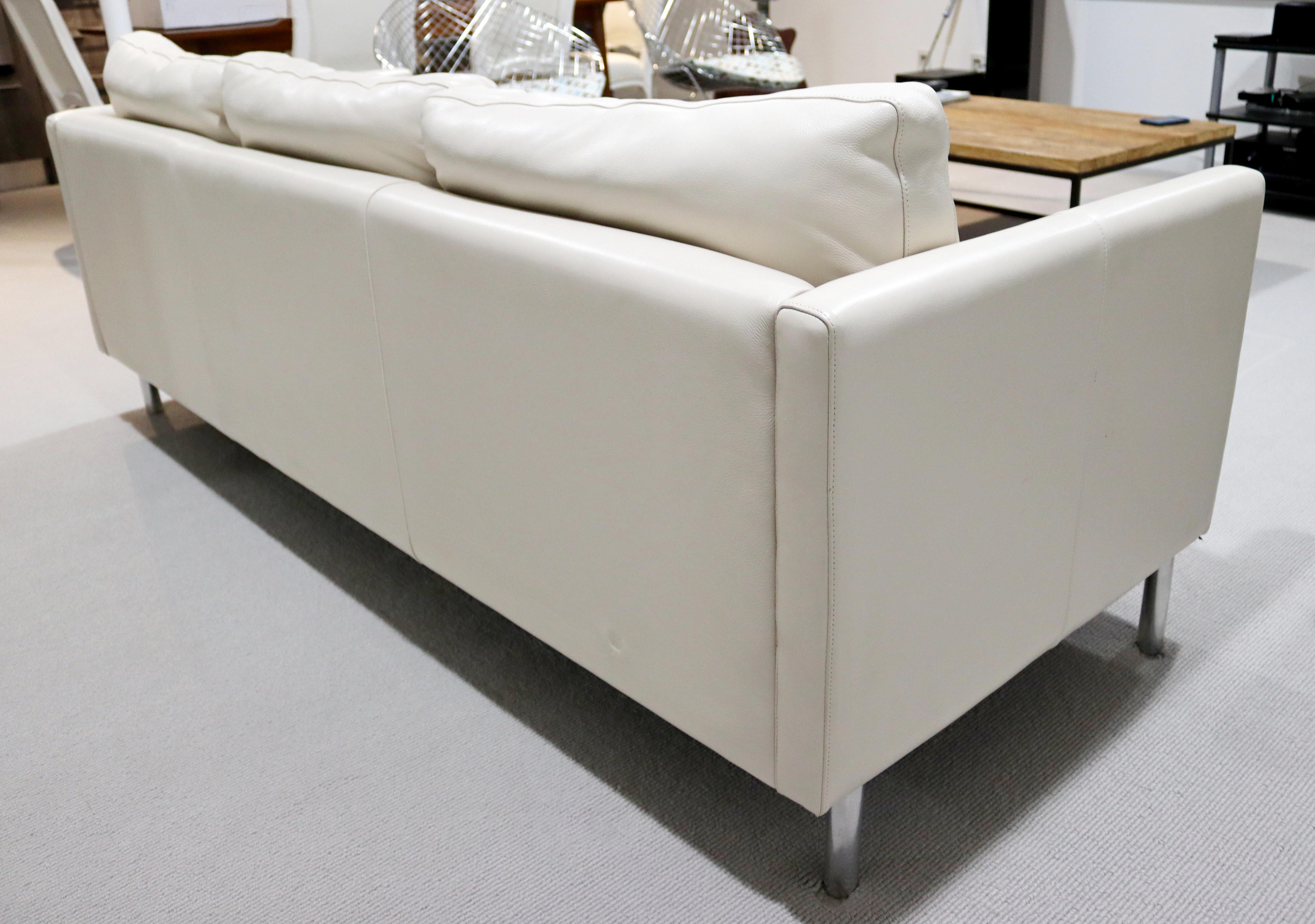 white leather sofa with chrome legs