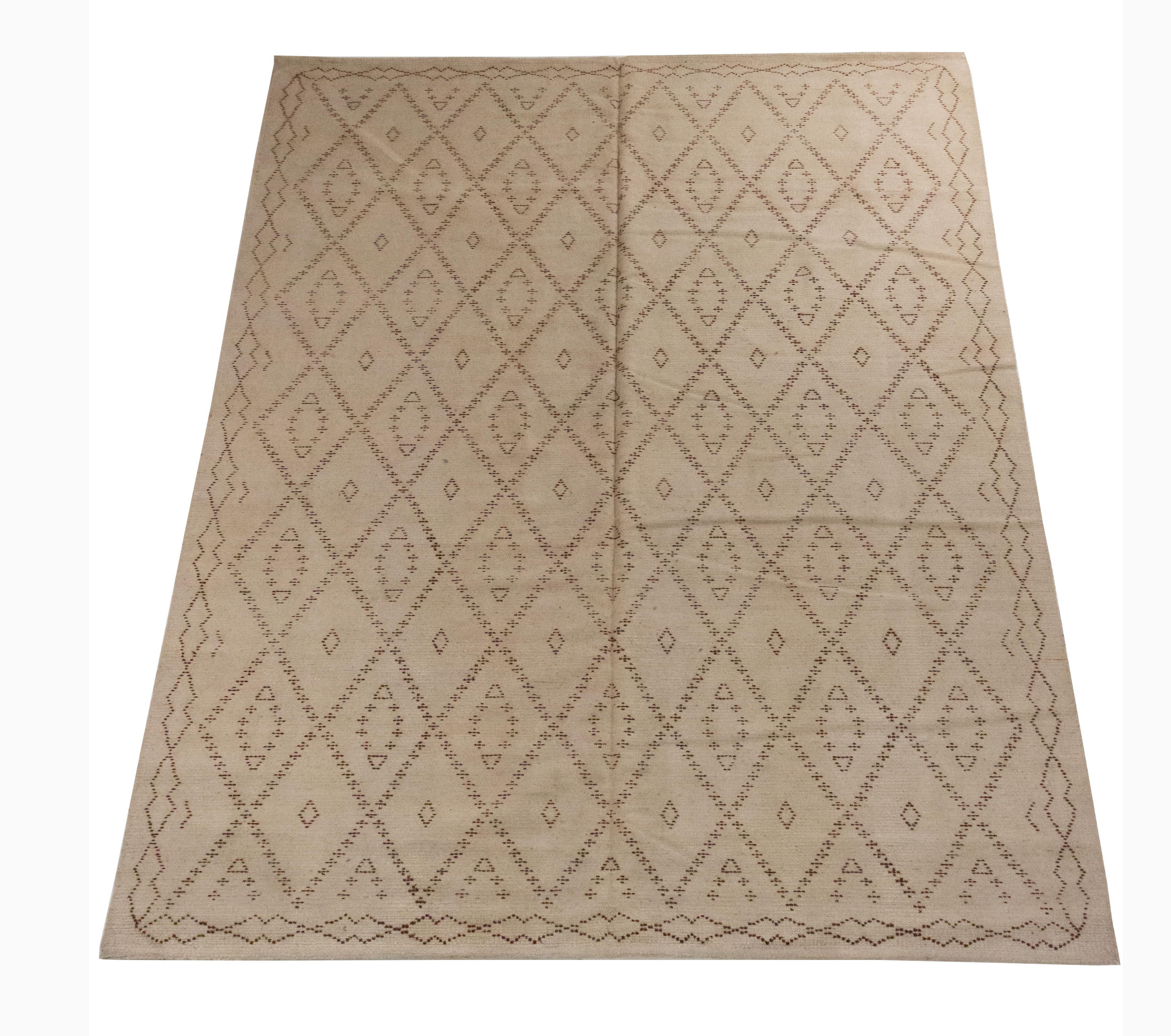 Contemporary cream and brown flat-weave rug in a Moroccan pattern.