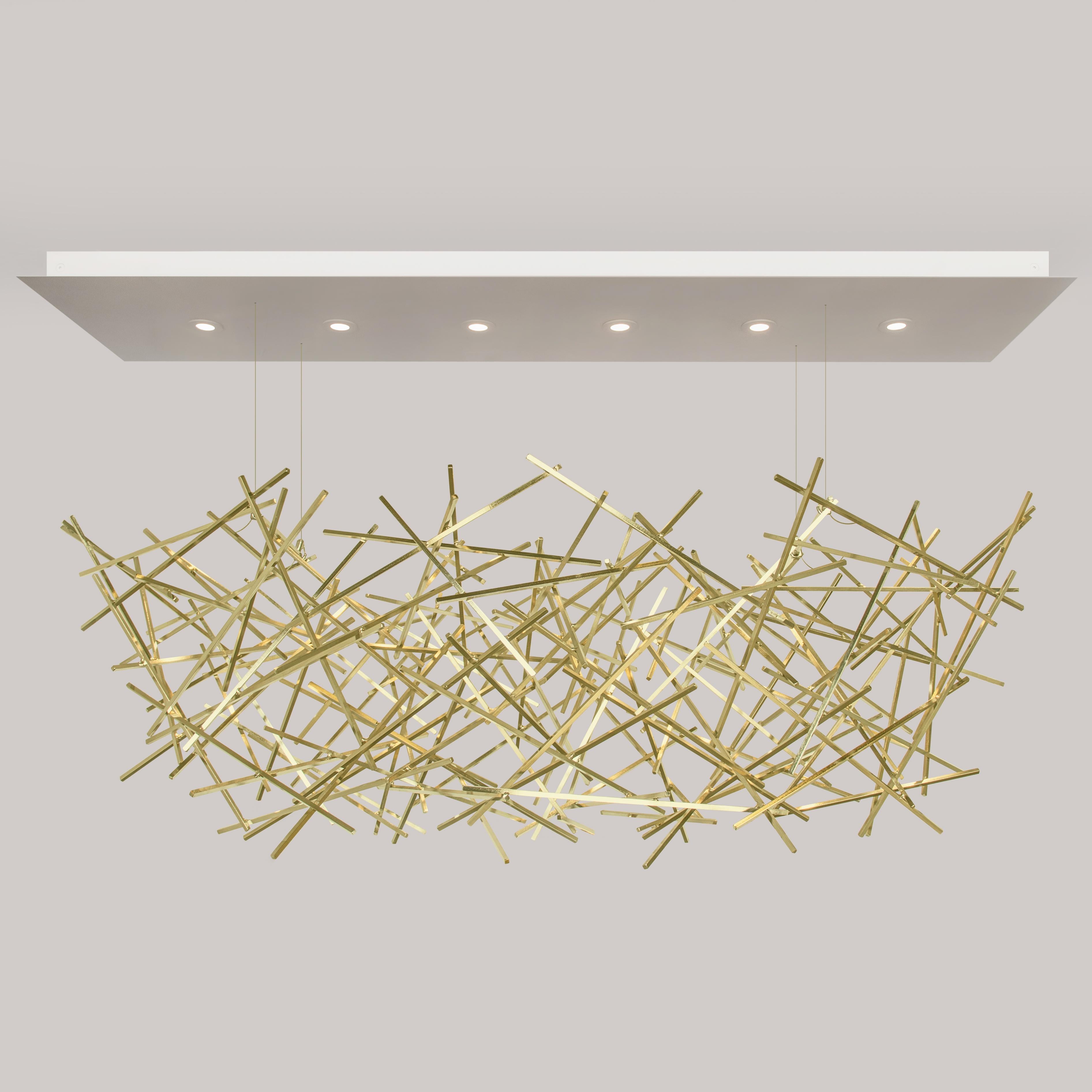 The CRISS-CROSS Chandelier was created from a genuine desire to blend art with lighting. It is a sculptural piece that is composed of cut steel rod, carefully arranged and welded in a seemingly random pattern. The CRISS-CROSS is lit from a canopy