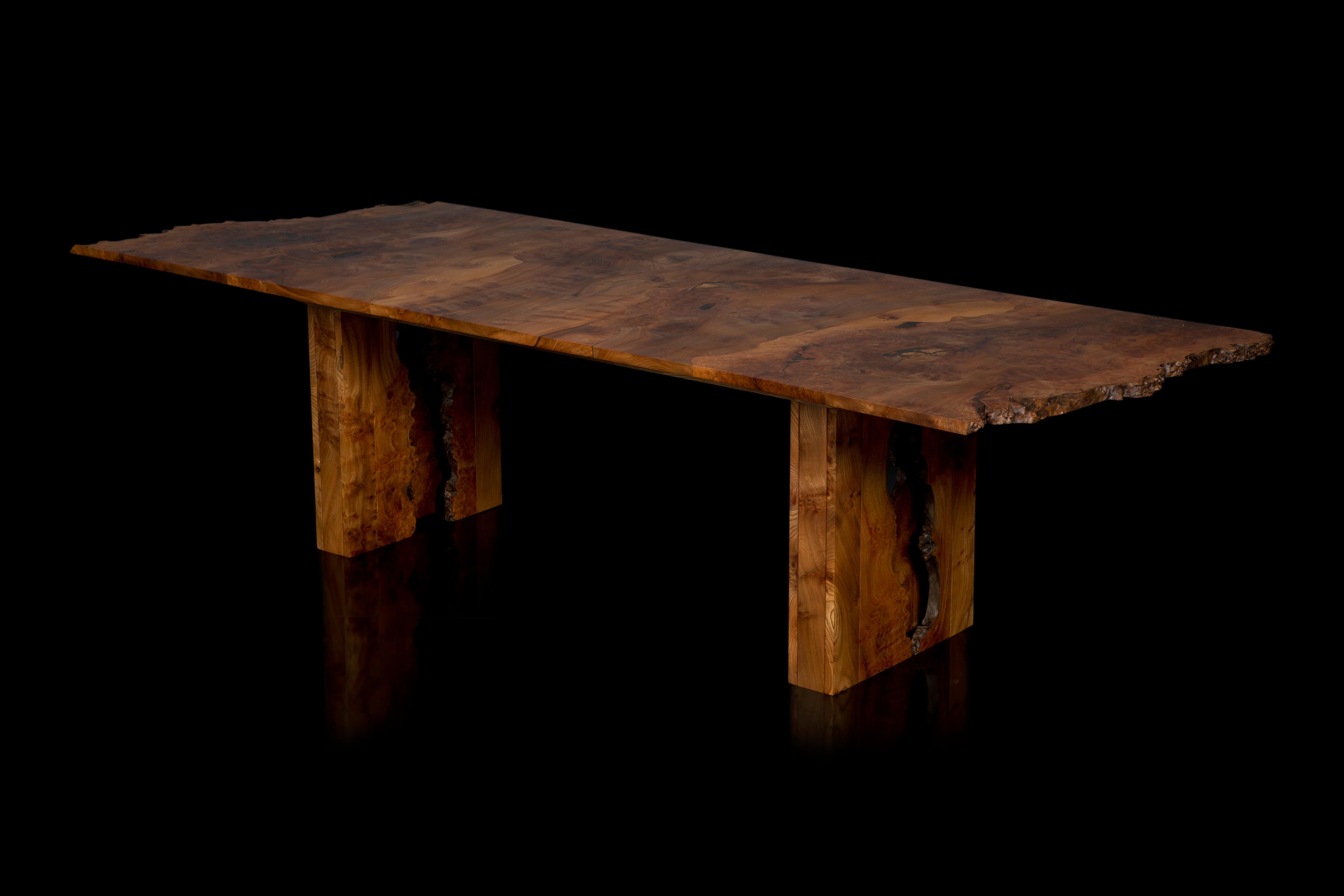 Elm dining table with cross-grained top and inverted live edge legs.

The table pictured was the first to be made in 2019 from a very striking Scottish burr elm timber that has a wonderfully rich conker brown colour when oiled, we have enough of