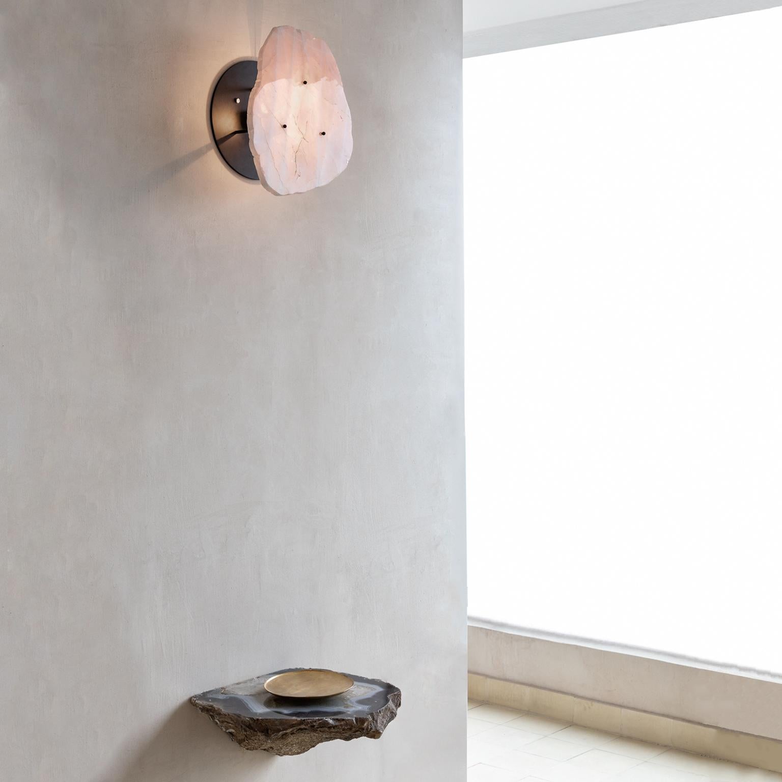Contemporary wall light, in carbon steel and crystal.
Produced in São Paulo, Brazil.

This contemporary crystal and carbon steel wall light was meticulously handmade by master artisans one delicate piece at a time. It is therefore quite difficult,