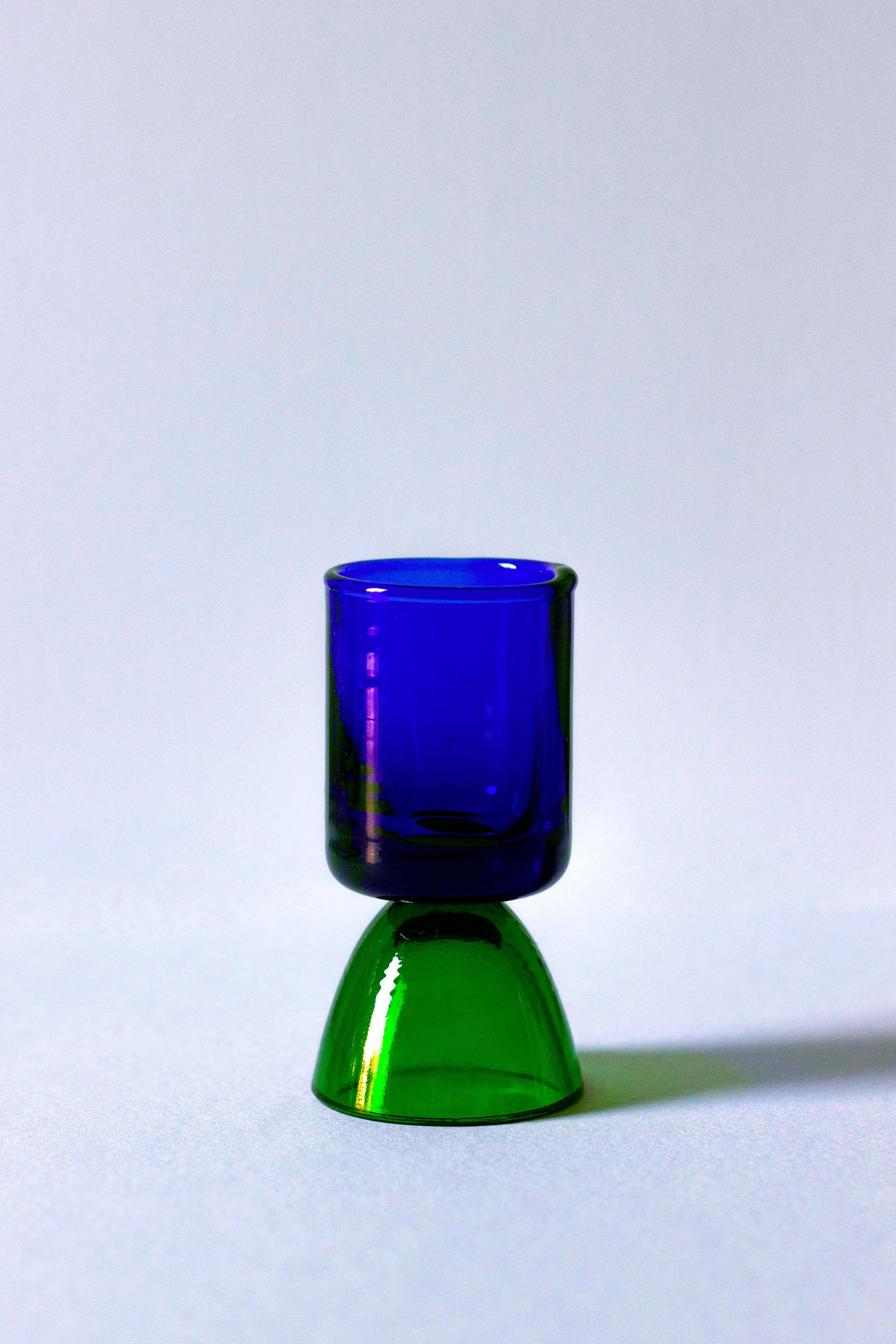 Enjoy a shot with this tequila glass, handcrafted in tuscany by skilled artisans. Ideal for savoring tequila, mezcal, or other fine spirits, this glass from the wonder crystals collection comes in a blue/green adding sophistication to your table