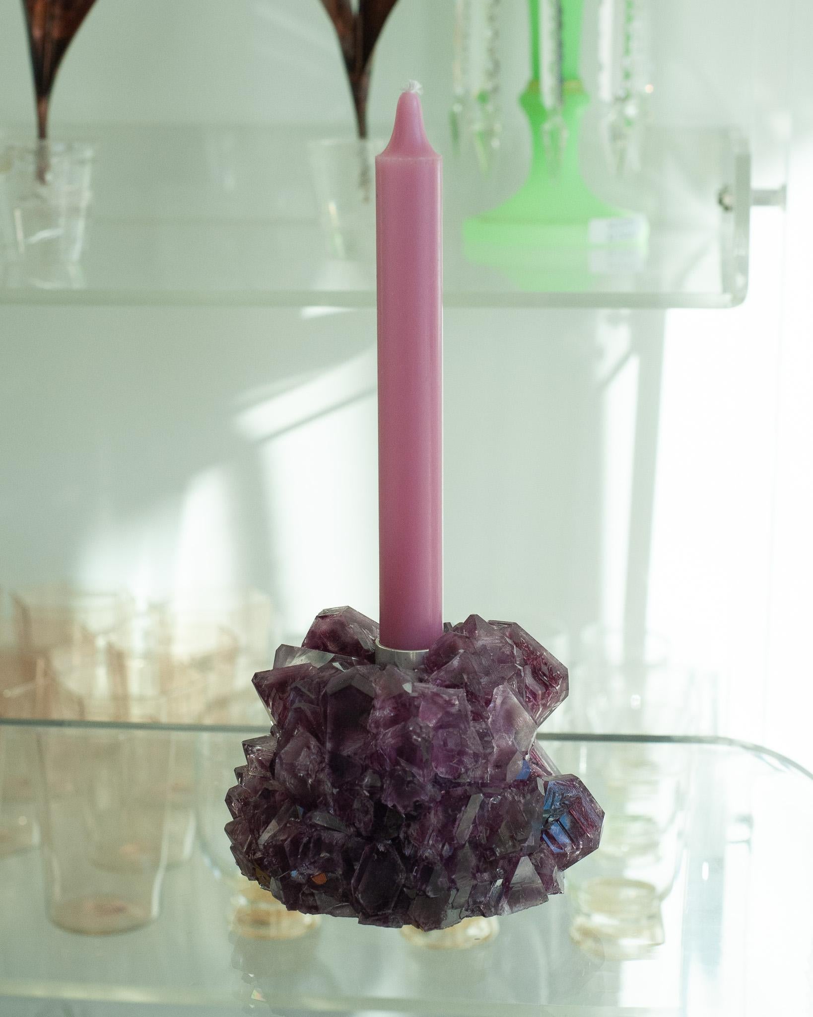 A stunning crystallized candleholder in purple, by artist Isaac Monté. This original work of art is produced through fascinating process, combining science and art. By dissolving minerals and oxides in hot water, the artist forms a solution that