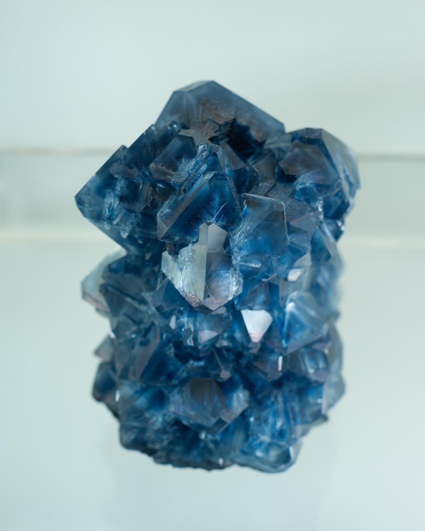 A stunning crystallized vase in sapphire blue, by artist Isaac Monté. This original work of art is produced through fascinating process, combining science and art. By dissolving minerals and oxides in hot water, the artist forms a solution that