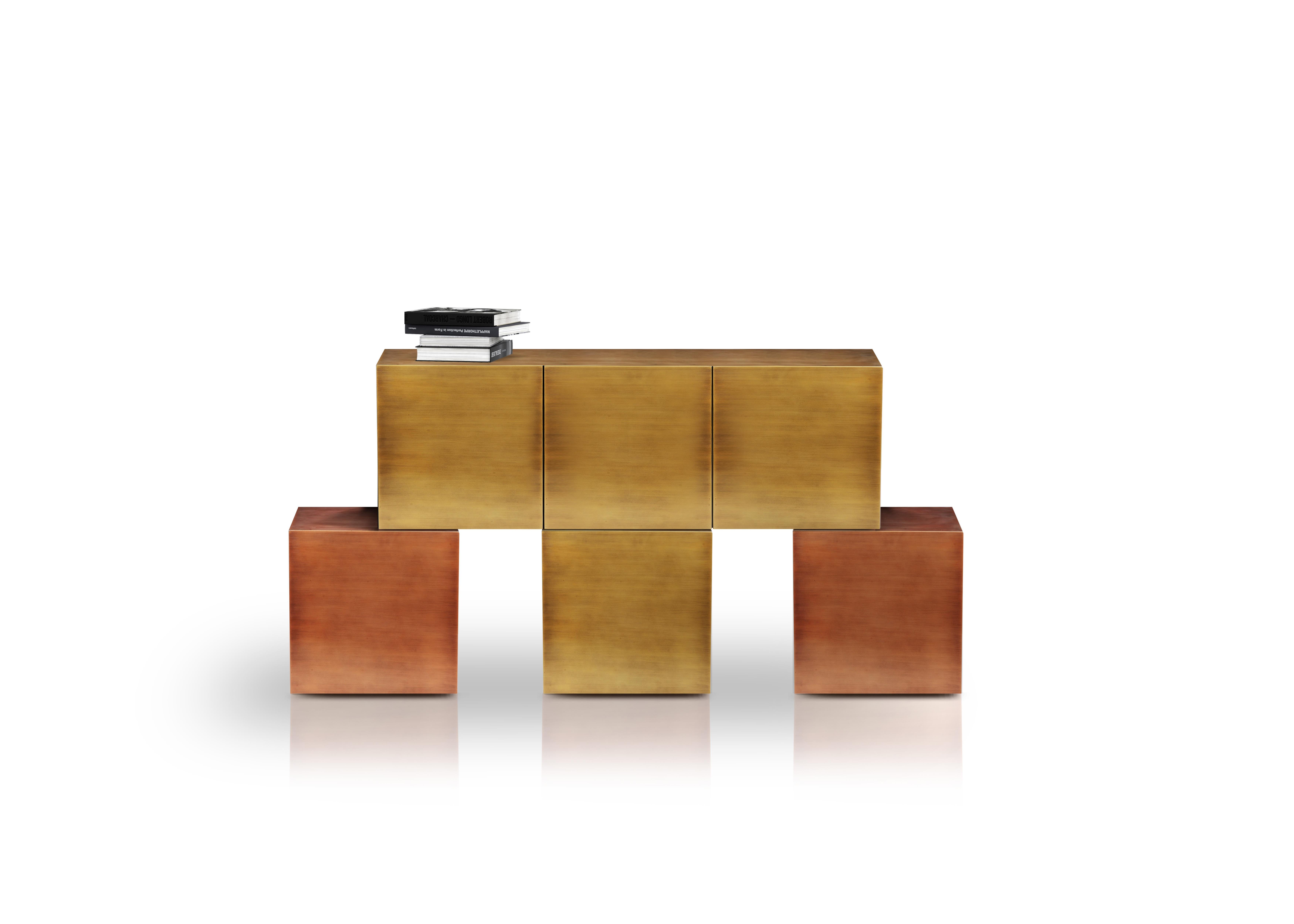 Cucu sideboard by Railis Design is the perfect addition to any modern living room or dining room. Store away your plates or knickknacks in a stylish way. Made from brushed brass and copper. The Cube sideboard comes with six doors that open and eight