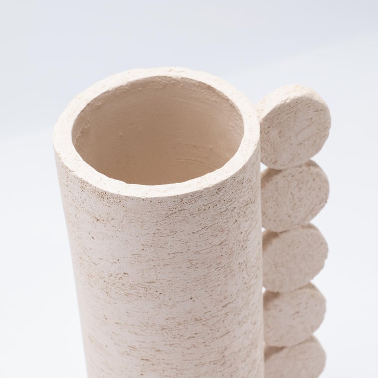 The Bibi vase is part of the Australe collection
It is made with a clay slab, that means, by folding a clay slab around a disc- shaped base thus to create the structure, which is then manually modelled for a long time with the help of set squares