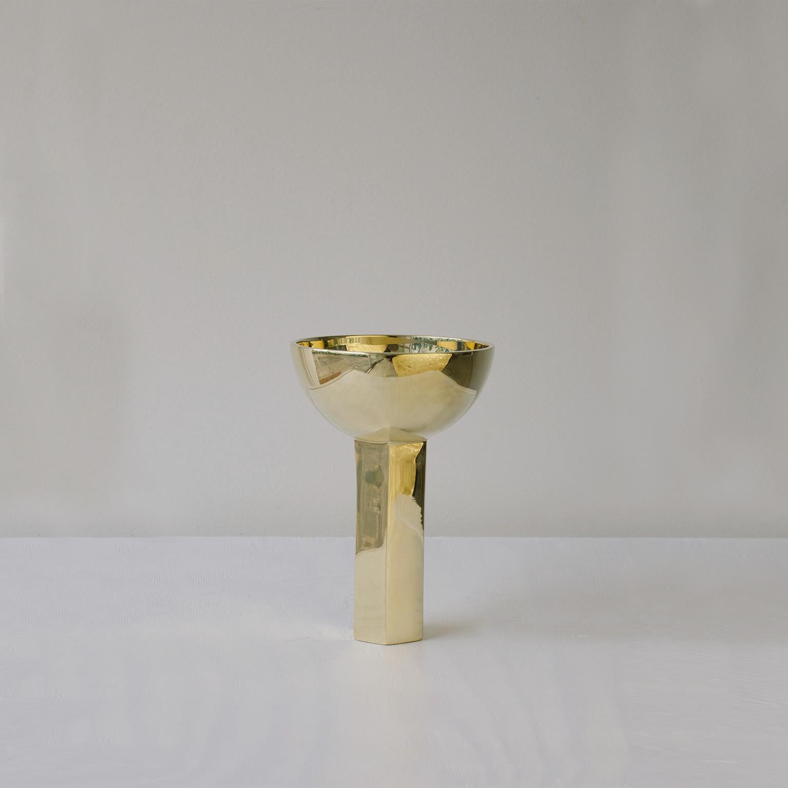 Produced in São Paulo, Brazil.

This contemporary cup in cast brass was meticulously handmade by master artisans one piece at a time. It is therefore quite difficult, if not impossible to make identical items. The brass casting is produced by