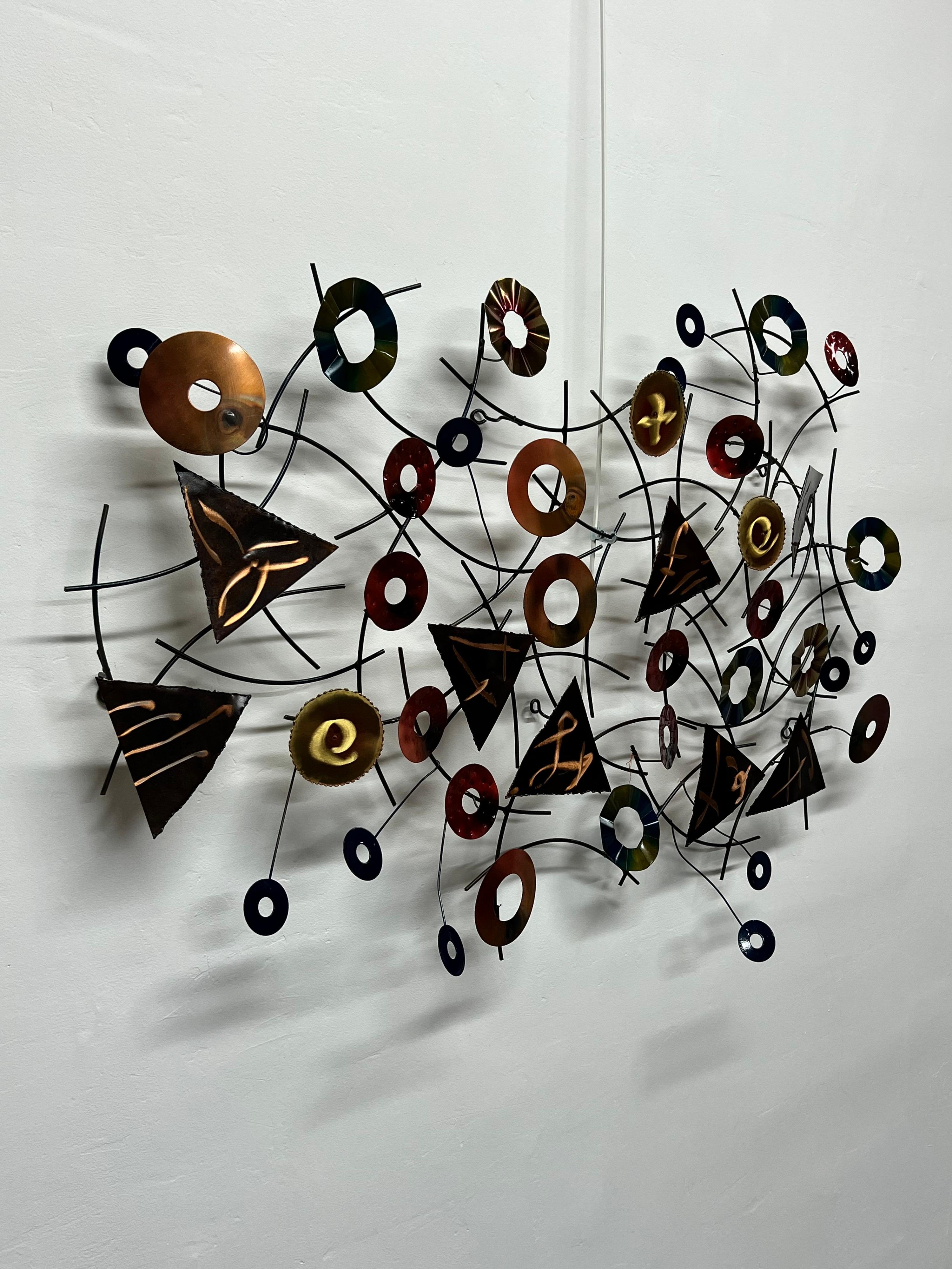 Contemporary mixed-media wall art sculpture fabricated by the artisan house Curtis Jere (C. Jere Artisan House). Dated 2002.
     
