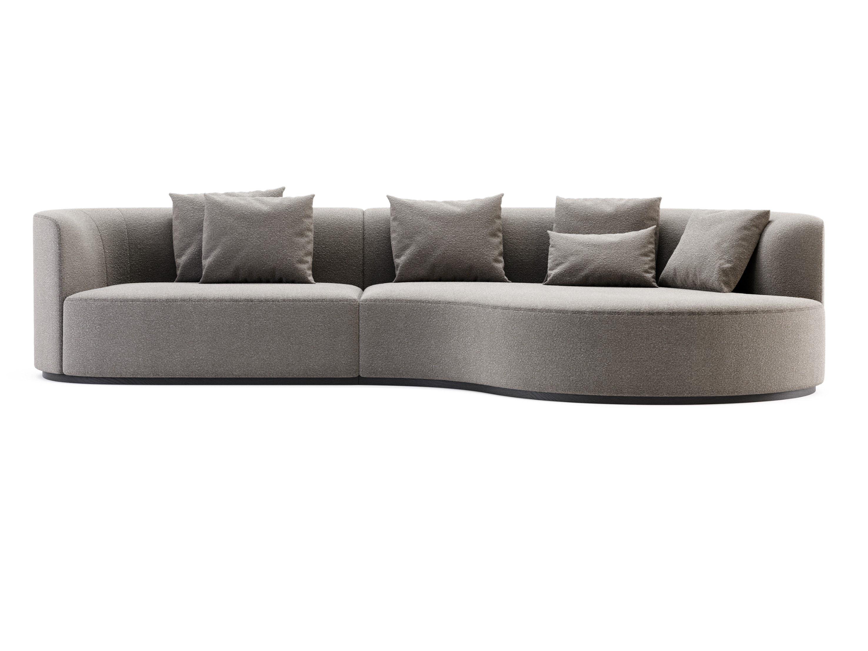 Made to order sofa with deep curved chaise offered in a selection of luxurious performance soft fabric. 
The base is offered in metal or wood in several colors and finishes.
The metal is polished or brushed stainless steel in several colors.
The