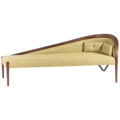 Contemporary Curved Chaise Longue made in Walnut with Green Upholstery Fabric.