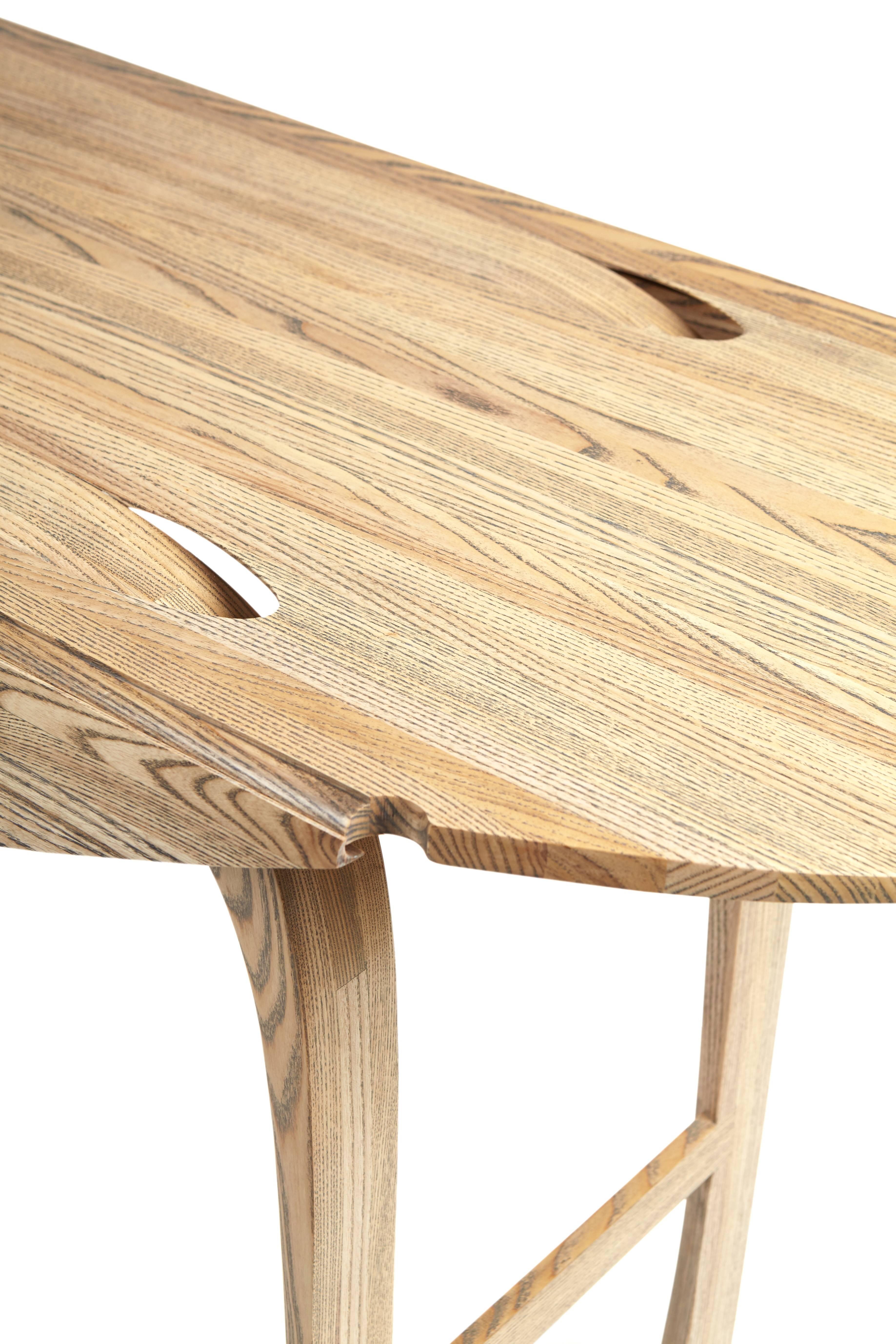 Laminated Oval Drop-Leaf Table in solid ebony grain and white oil ash by Jonathan Field