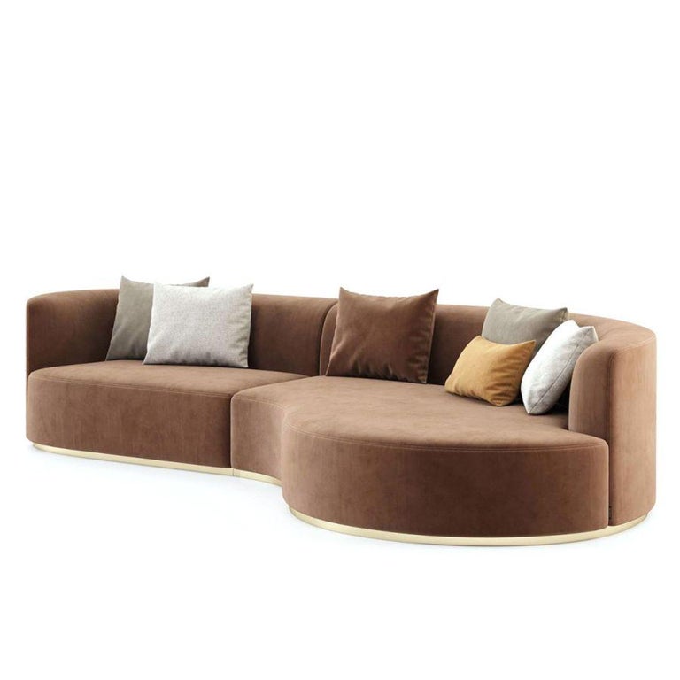 Made to order sofa with deep curved chaise offered in a selection of luxurious performance soft velvets. The velvet is stain resistant, and water repellent.
The base is offered in metal or wood in several colors and finishes. 
The metal is polished