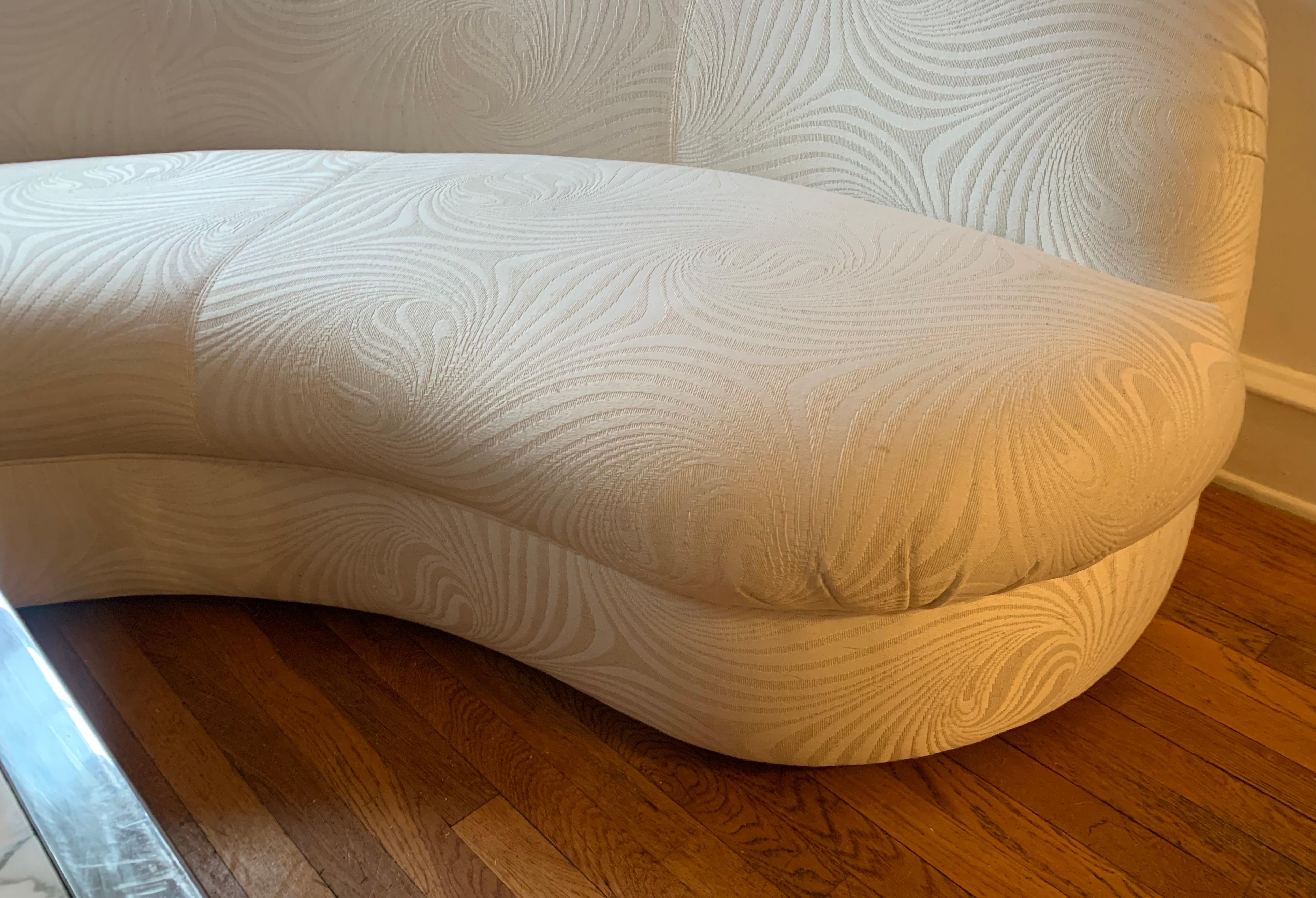 Who doesn't love a crisp white crescent sofa?

This pair of sofas was kept in the formal sitting room of a 1990's home, and they saw little use.

The upholstery is in good condition with no re-upholstery needed.

While this is absolutely in the