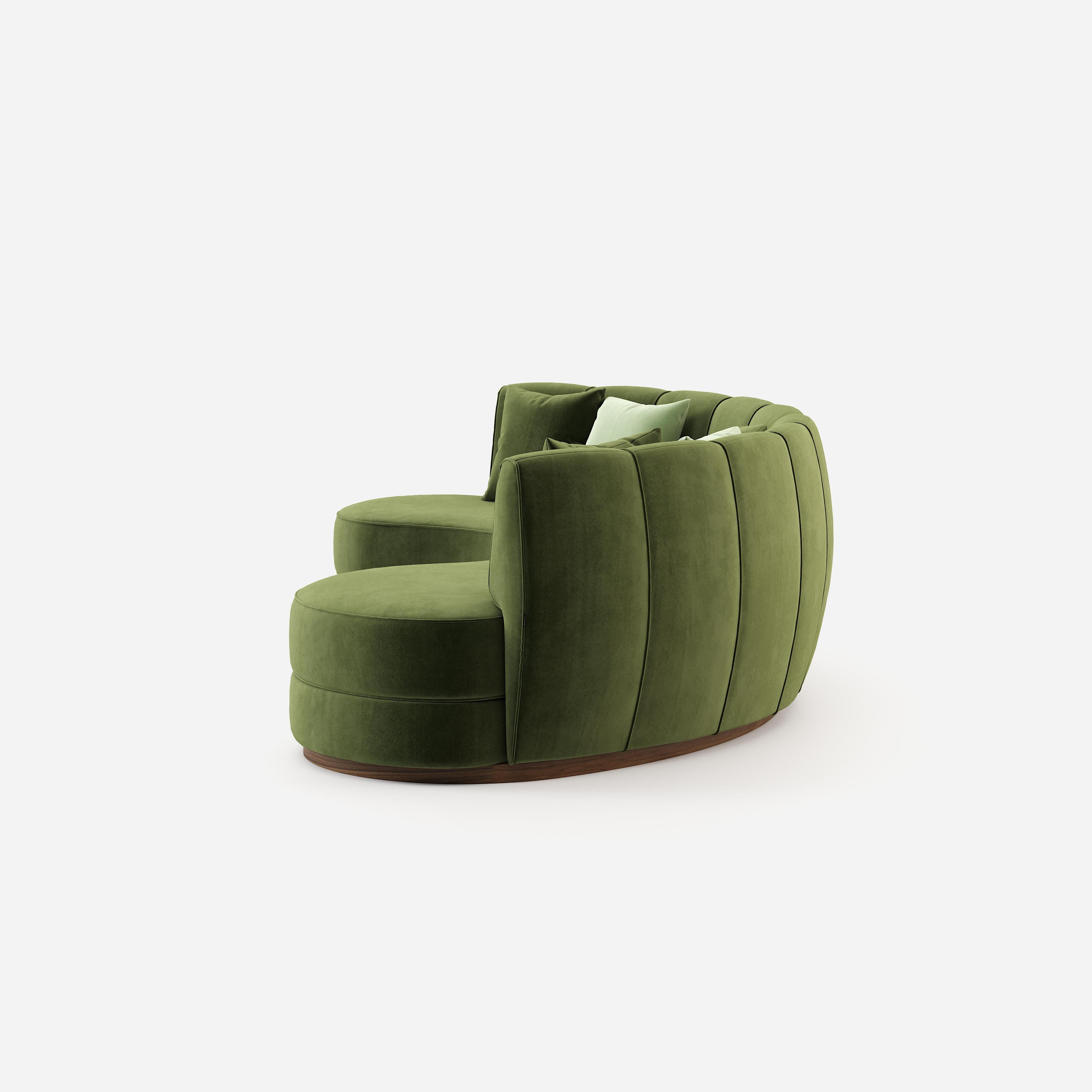 green velvet curved sofa