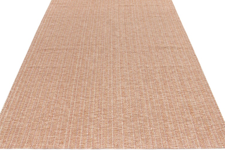 Contemporary Custom Kilim rug in Gold, Red, White Stripes, by Rug & Kilim
Description: Handwoven in wool, a custom flatweave rug design available from our Kilim & Flatweave collection, enjoying textural braids in golden, red & white for a