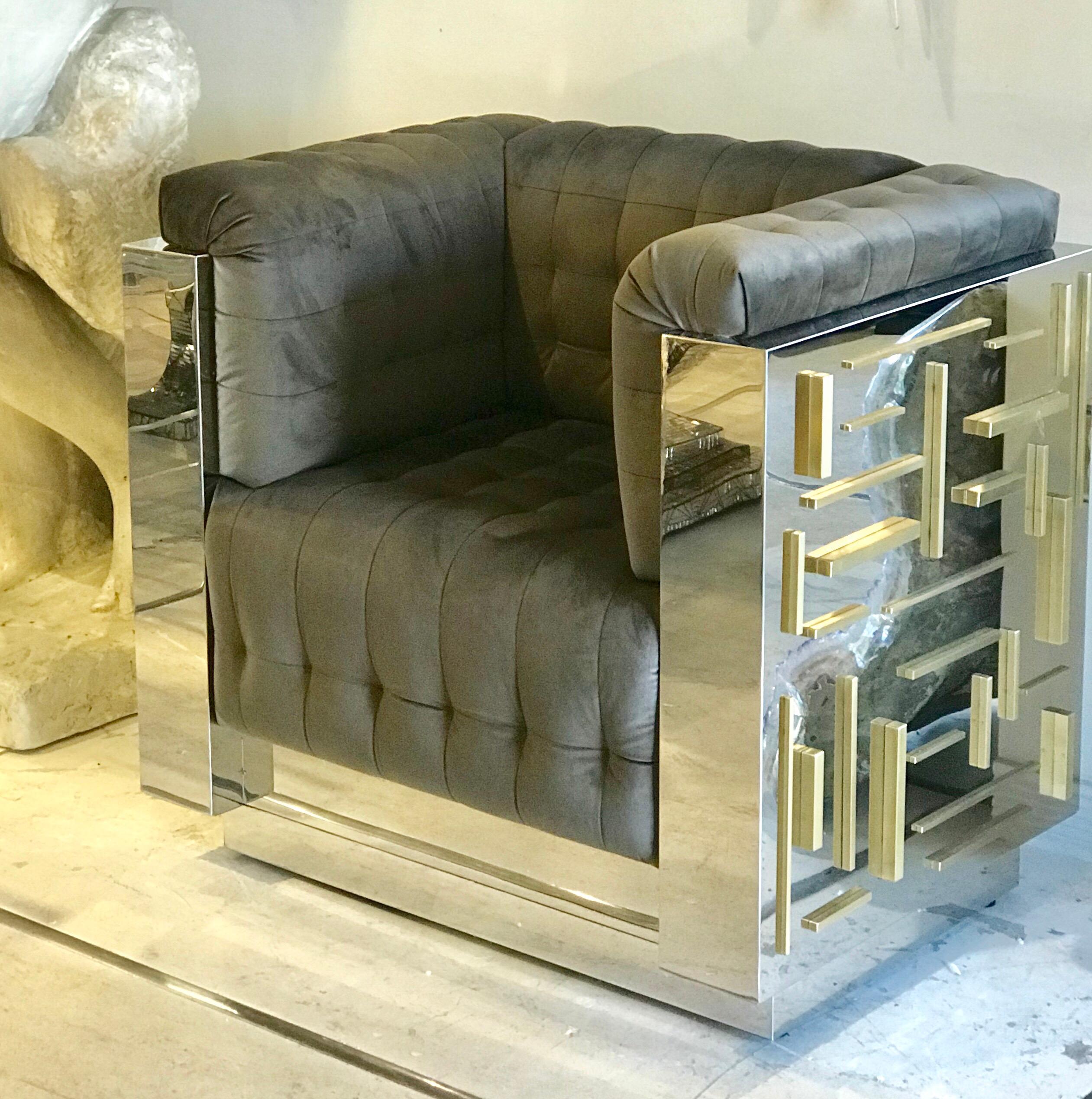 Sculptural custom made and handcrafted mirror polished stainless steel and brass set of 2 club chairs . A unique limited edition set available immediately.
Chairs measure: 33