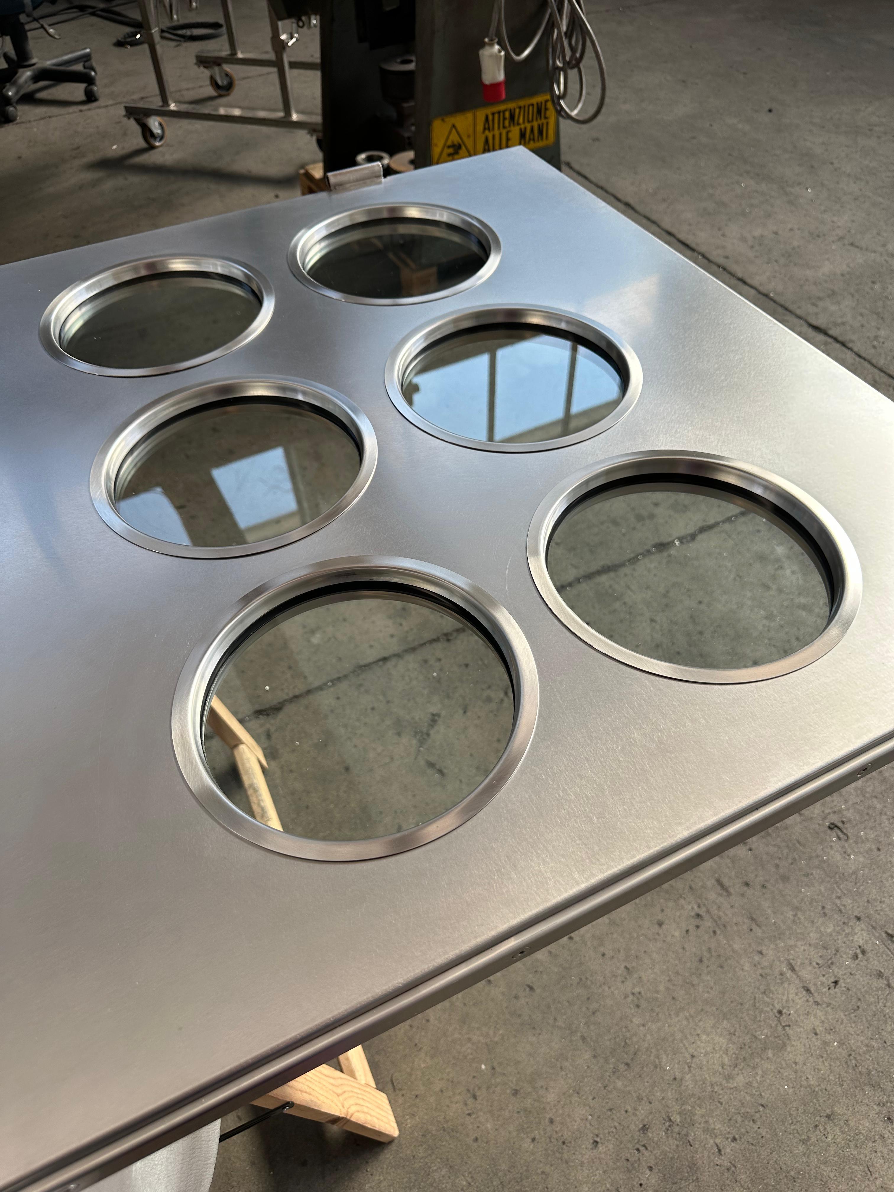 Contemporary custom made Spinzi stainless steel metal door with round portholes For Sale 4