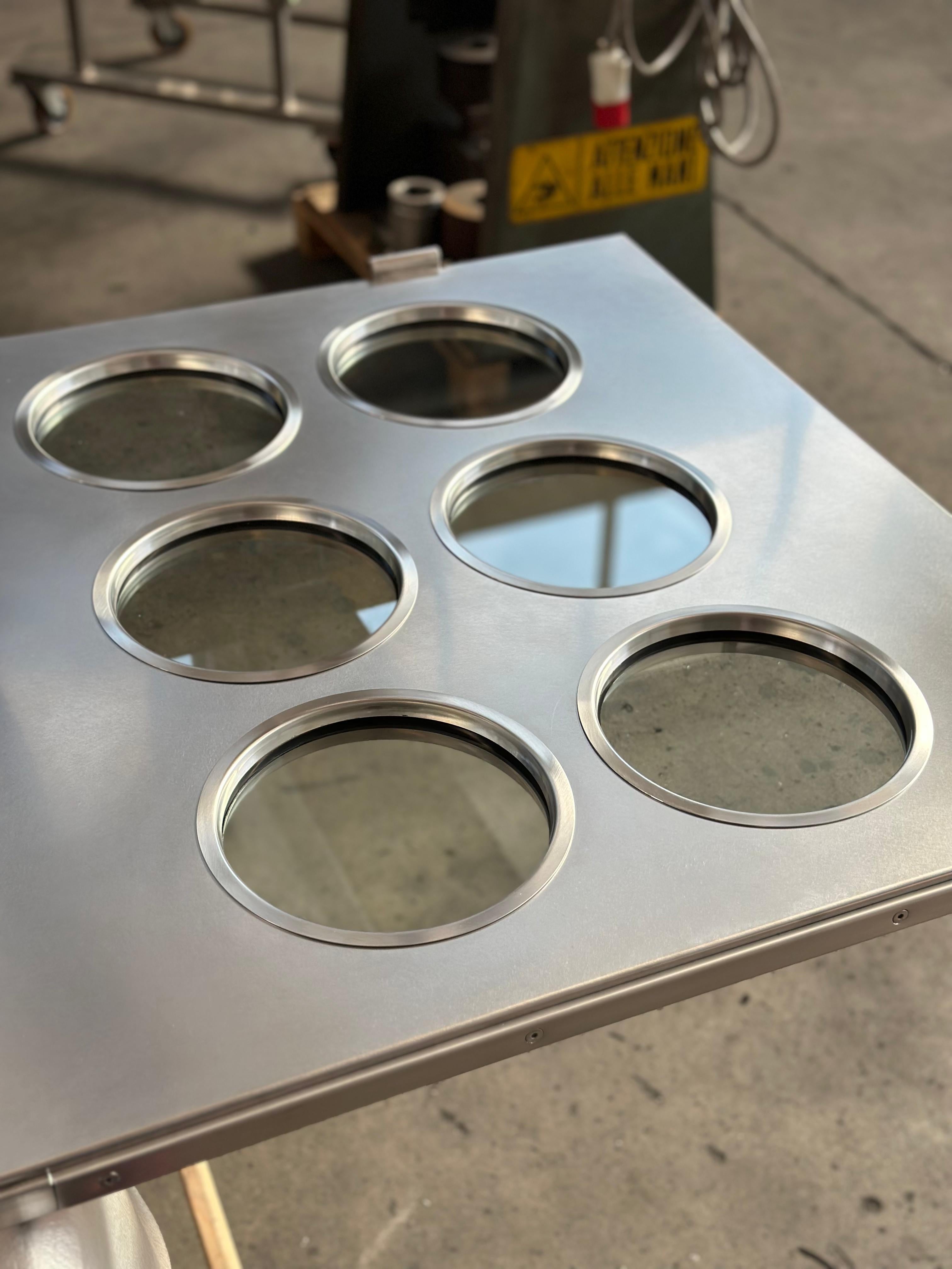 Contemporary custom made Spinzi stainless steel metal door with round portholes For Sale 6