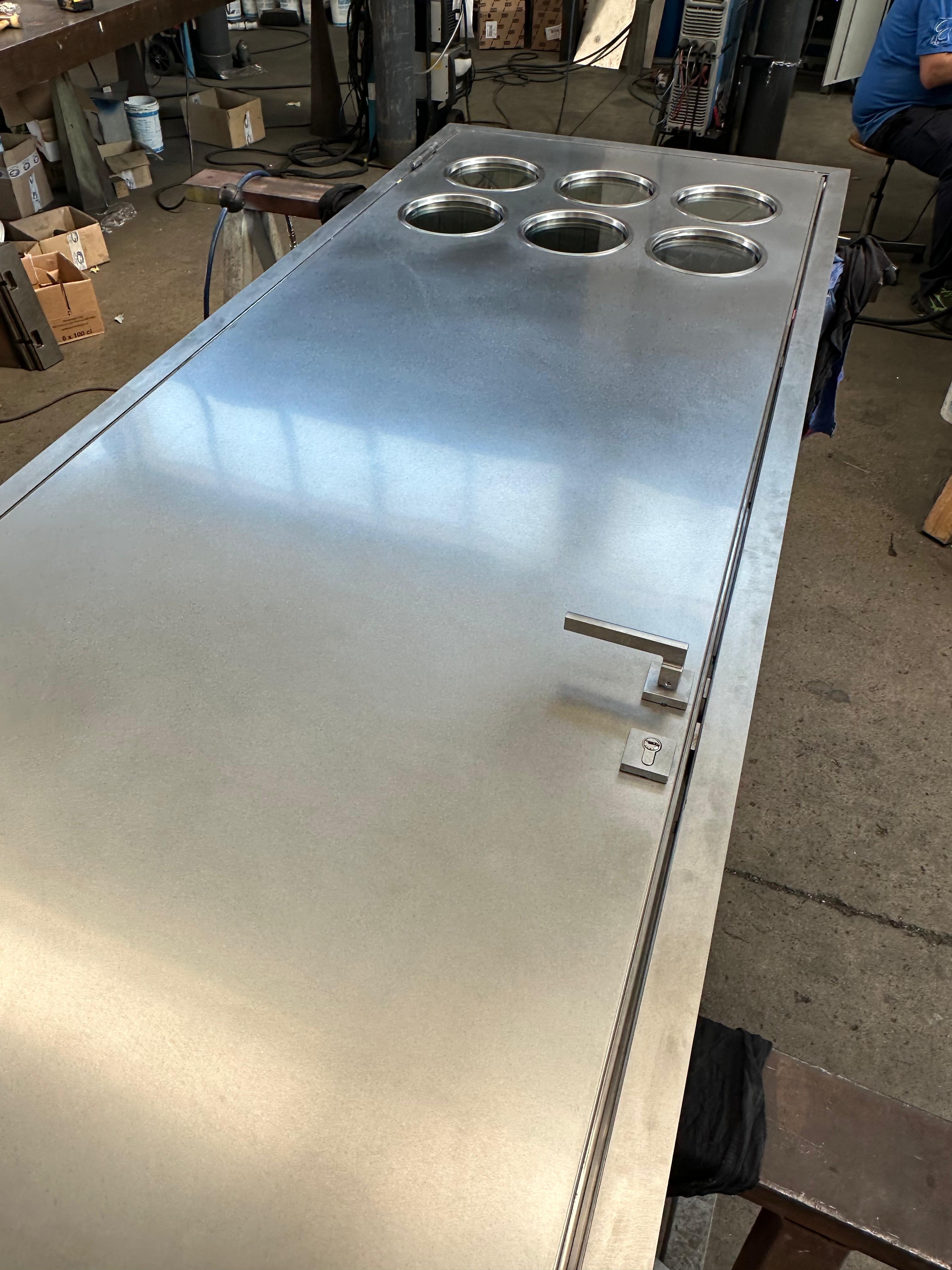 Contemporary custom made Spinzi stainless steel metal door with round portholes For Sale 13