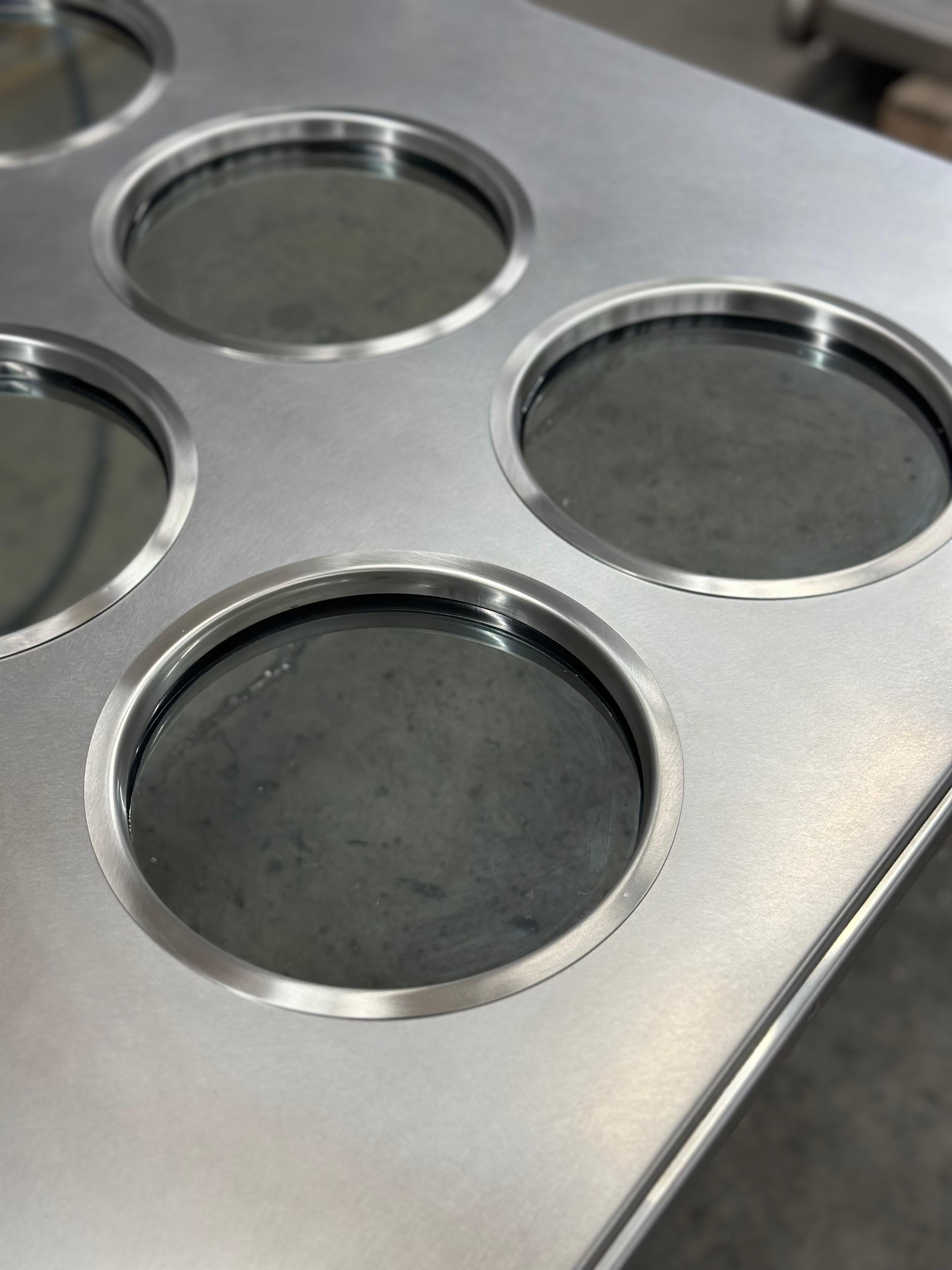Contemporary custom made Spinzi stainless steel metal door with round portholes For Sale 1
