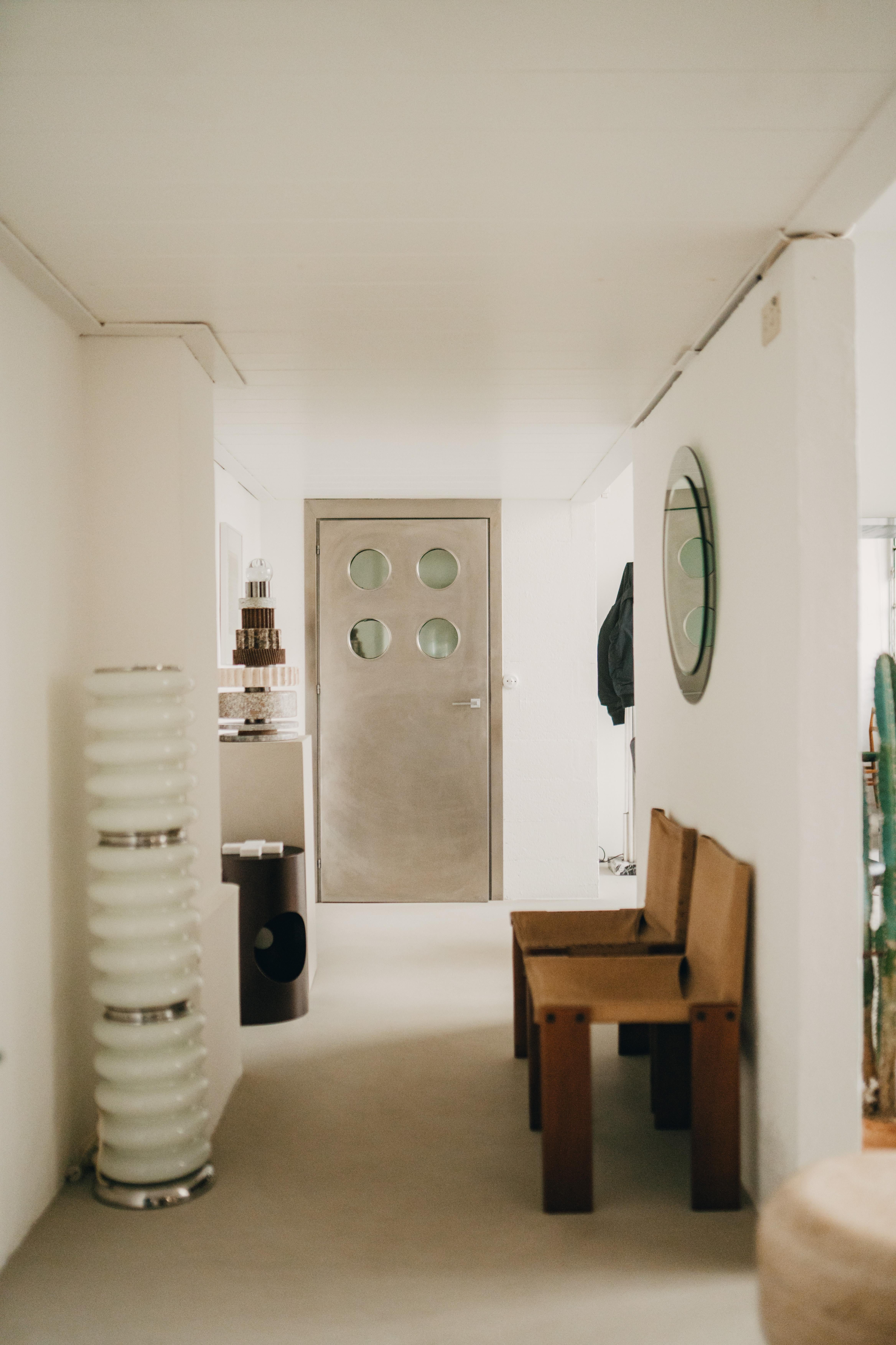 Contemporary custom made Spinzi stainless steel metal door with round portholes 2
