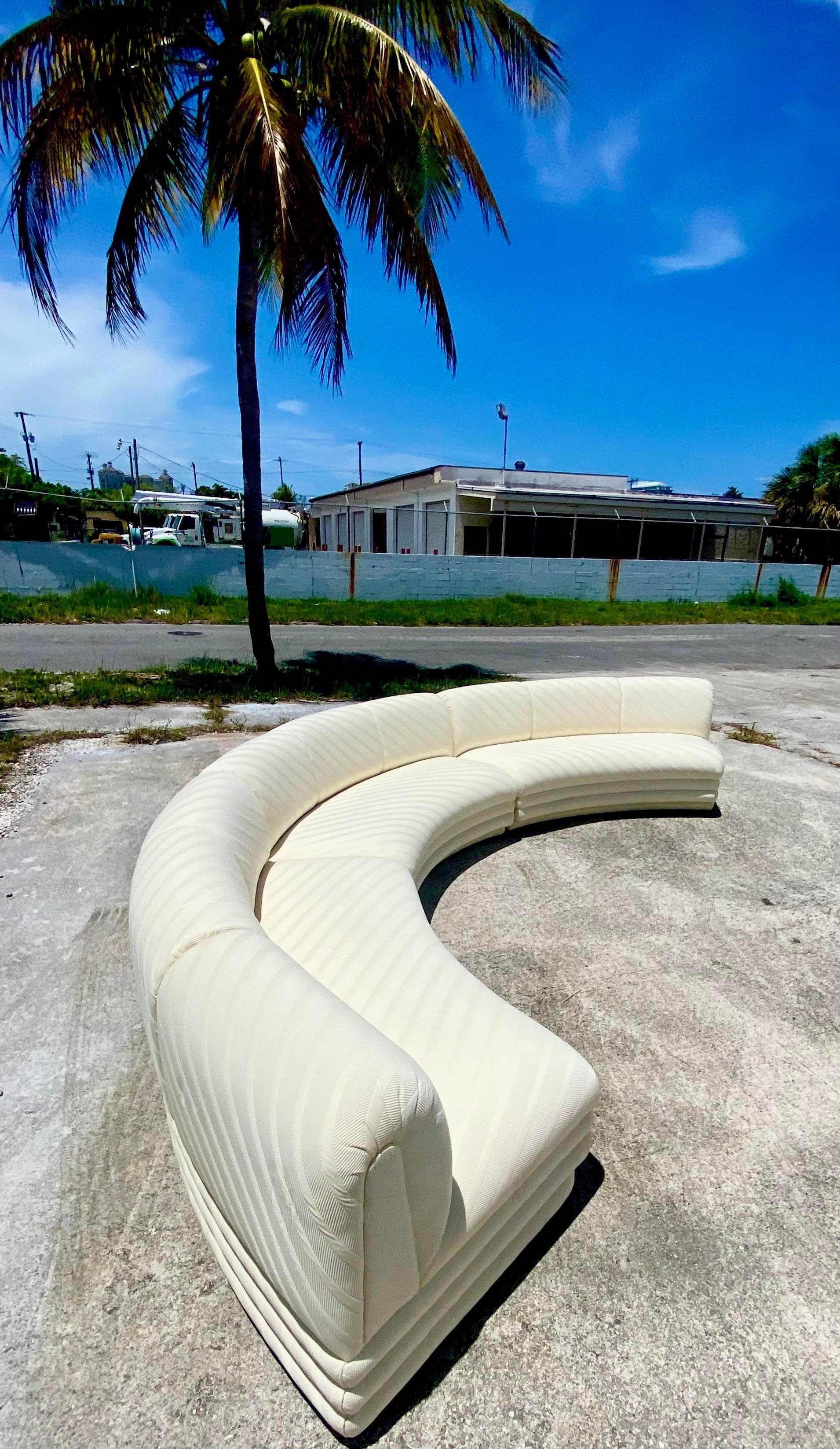 Fantastic vintage half moon sectional. A chic tonal jacquard on this custom built sectional. Channel tufting along the plinth. Three separate sections. They do not hook together. Acquired from a Palm Beach estate.