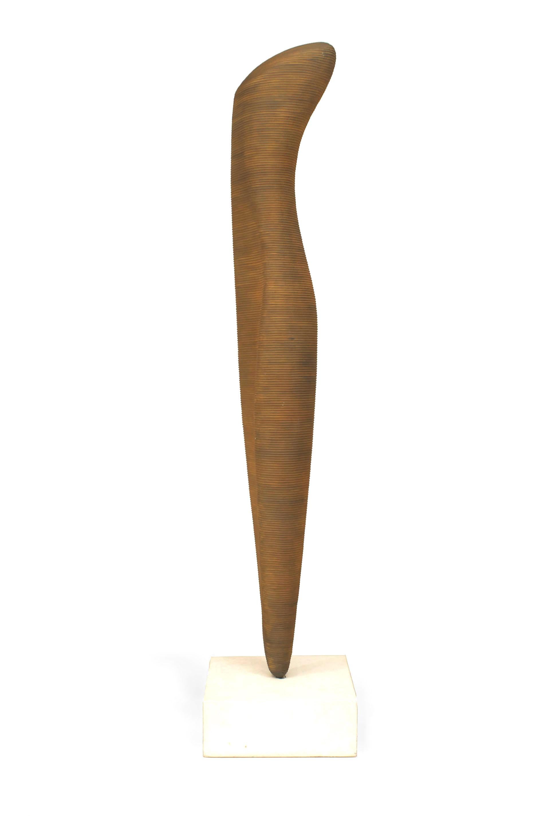 Contemporary sculpture called Cycladic Goddess (2007) composed of fiberglass reinforced resin with iron rust color surface. (KEVIN KELLY)
