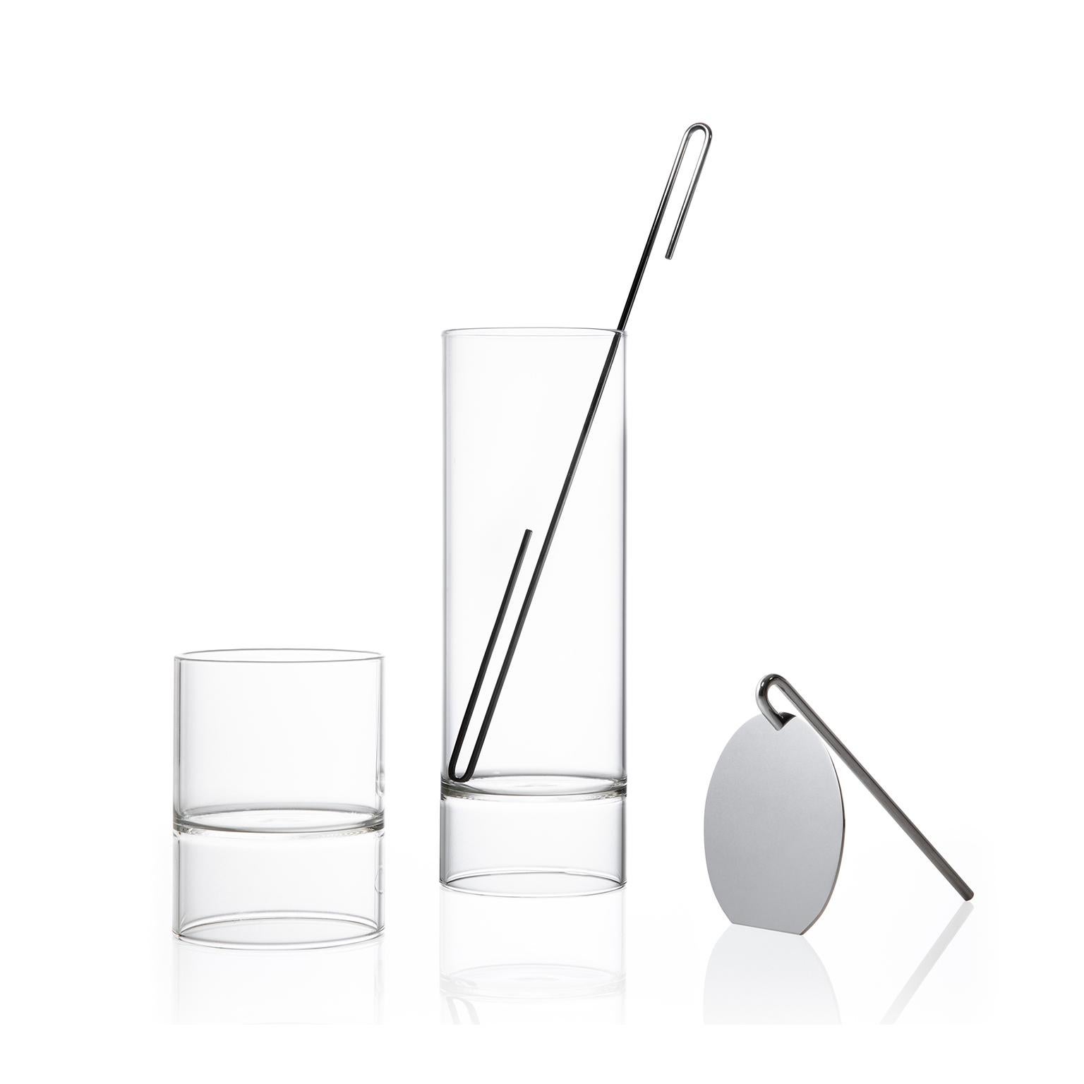 The contemporary Czech glass minimal Revolution collection set includes a cocktail mixer carafe, strainer, stir stick, and four double-ended Rocks Martini glasses.

Strikingly simple in form, the minimal Revolution collection is handcrafted in the