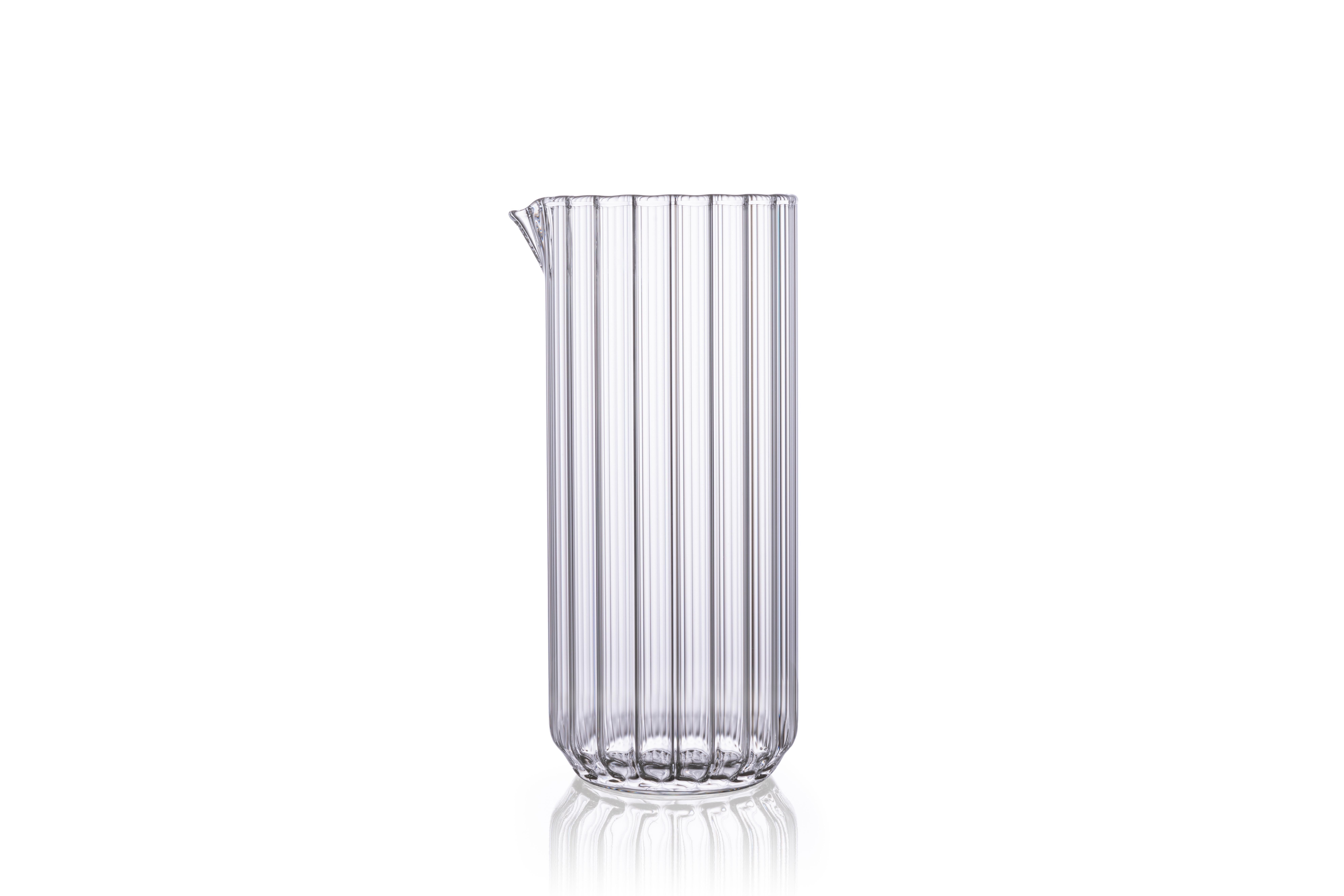 The Dearborn large carafe and four dearborn water glasses.

Perfect for everyday or formal dining settings or cocktails, the minimal and contemporary Dearborn Collection will enrich any occasion. It inverts tradition with a modern touch by having