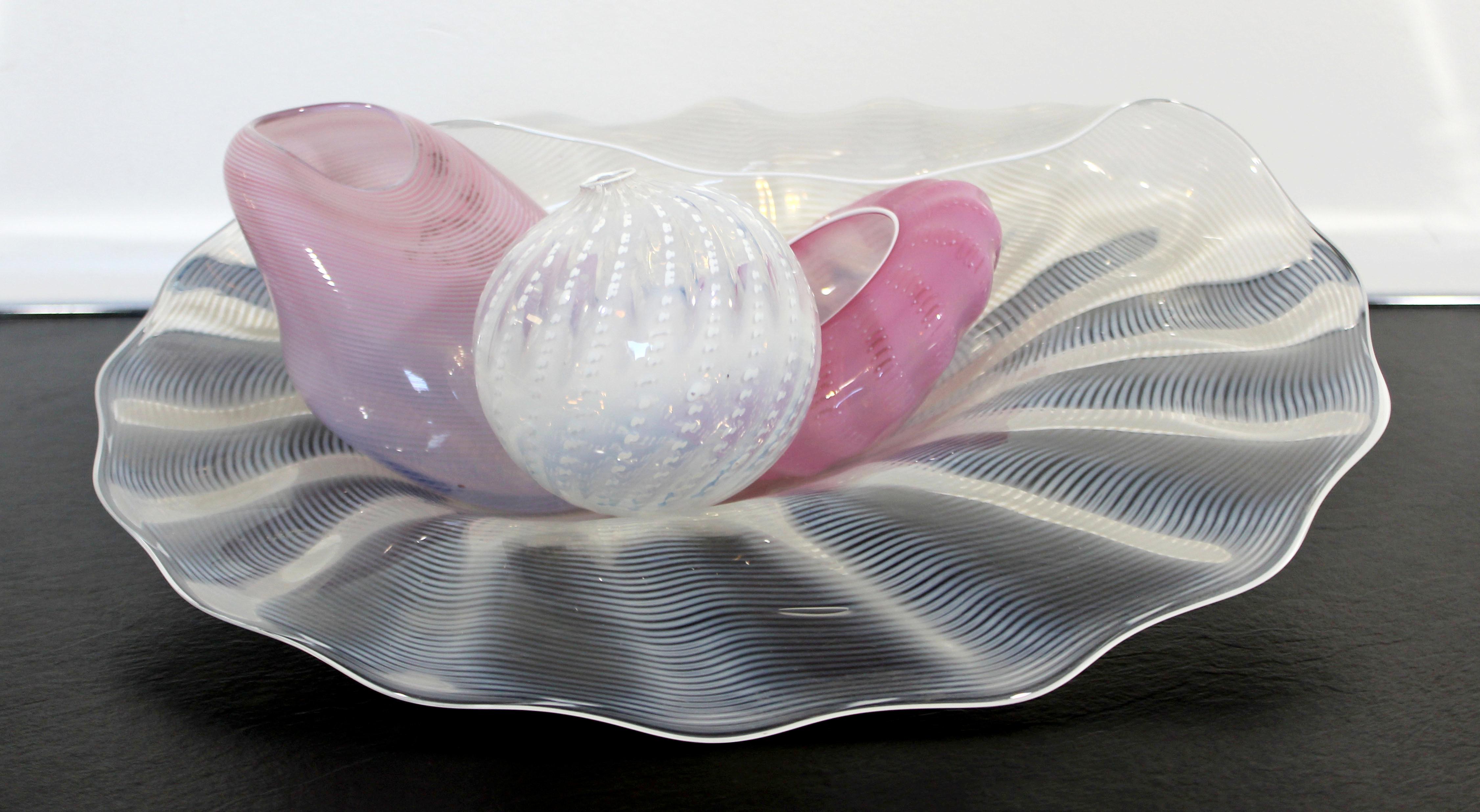 For your consideration is a pretty and pink, four-piece glass table sculpture, with a sea shell motif, by Dale Chihuly, circa 1990s. In excellent condition. The dimensions are 14