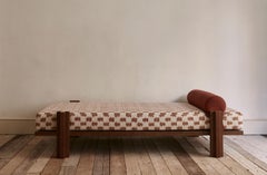 Contemporary daybed with walnut structure and mixed textile upholstery