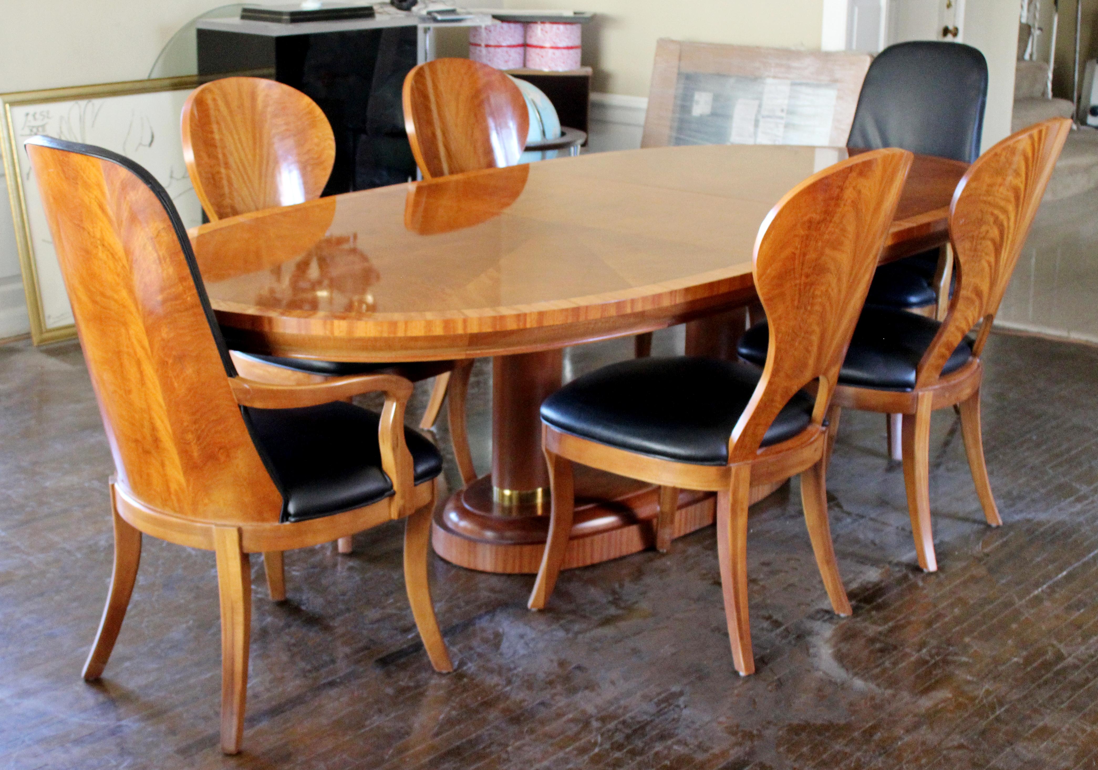 For your consideration is an utterly beath-taking dining set, with an expandable burl wood table and six chairs, two arm and four armless, in the Art Deco style, by Henredon, circa 1990s. In excellent vintage condition. The dimensions of the armless