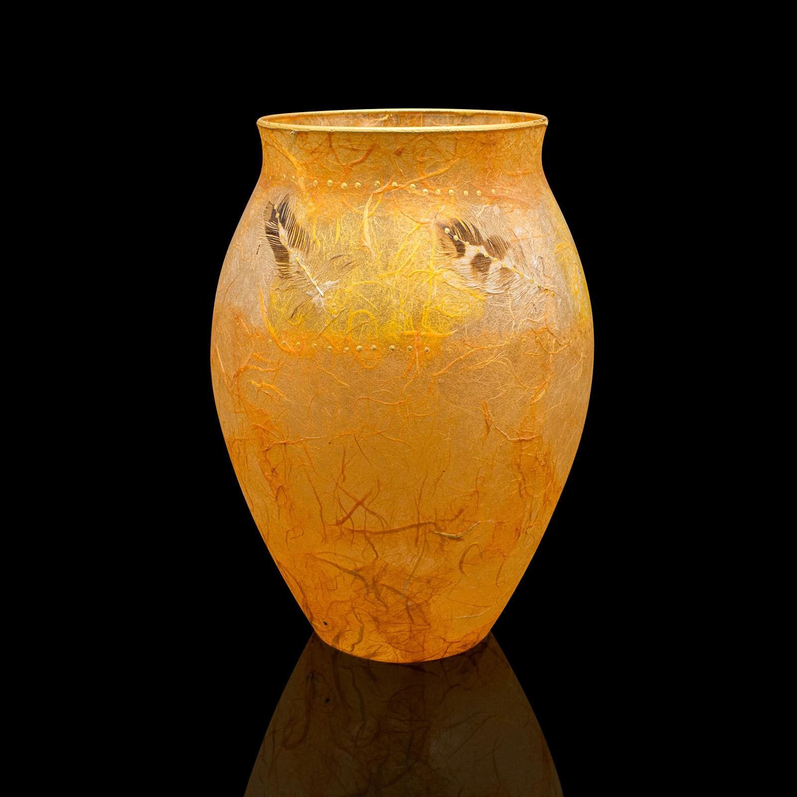 This is a contemporary decorative flower vase. An English, art glass and straw silk baluster urn by Margaret Johnson.

Appealing colour with a fascinating natural decoration
Displays a desirable, contemporary appearance
Eye-catching glass beams in