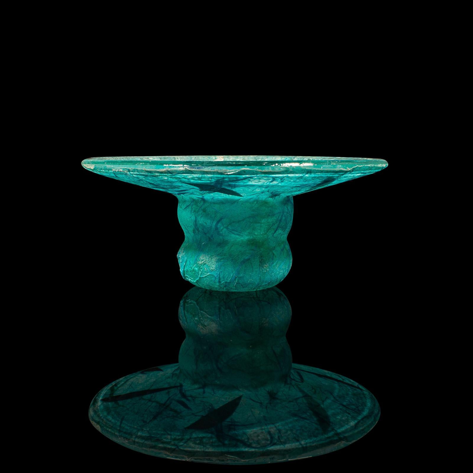 This is a contemporary decorative tea light stand. An English, art glass and straw silk votive holder by Margaret Johnson.

Striking colour accentuates this delightful tea light stand
Displaying a desirable, contemporary appearance
Colourful glass