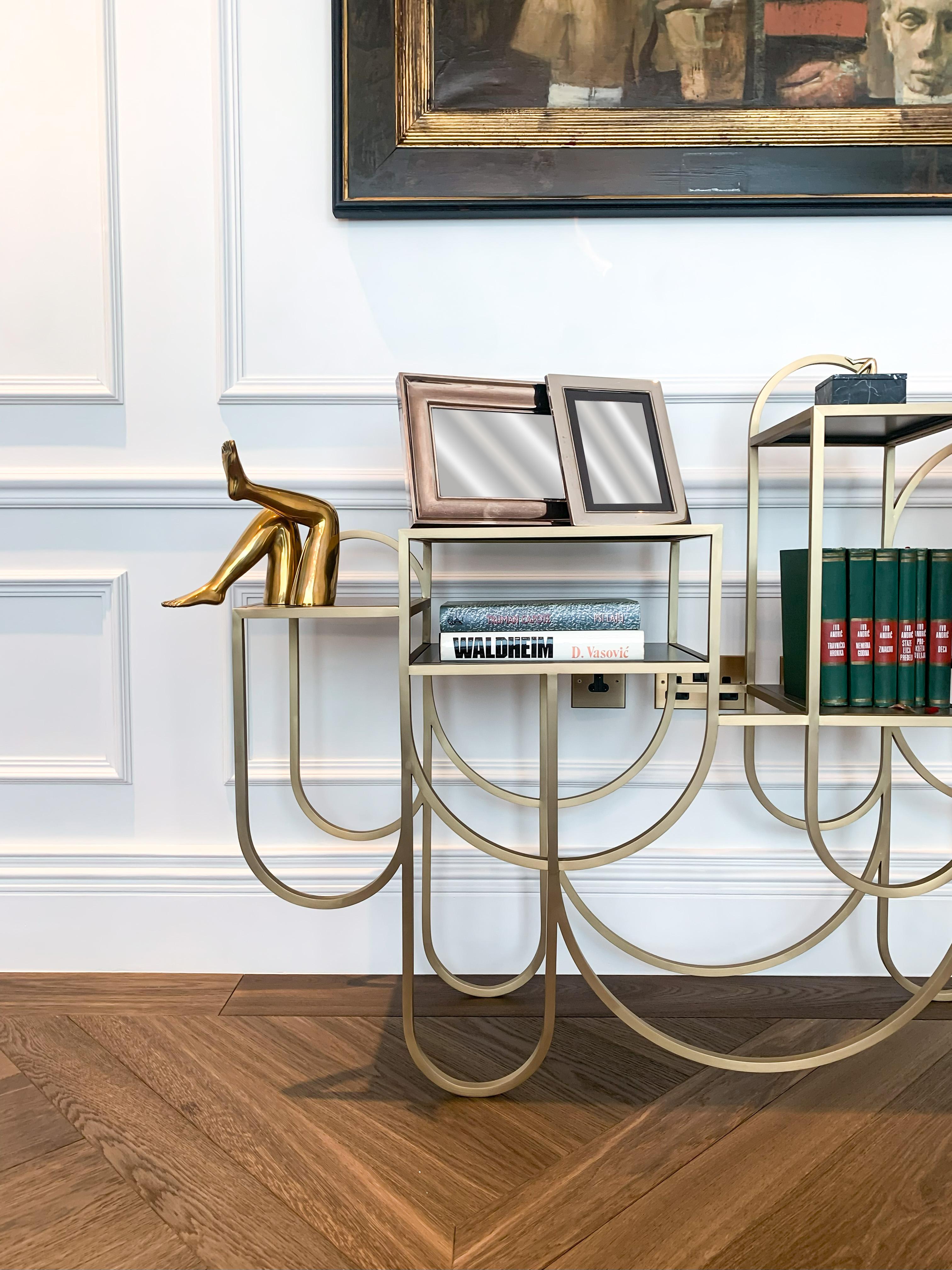 A contemporary design from Bohinc Studio’s Apollo series, this console table is a study in sculptural contrast and proportion. Fabricated in Portugal, it features a rare, custom-specified finish: a brushed brass frame paired with dark grey