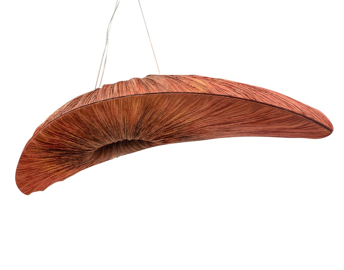 Liana S. Pendant by Studio Aqua.

Aqua creations are a small light making studio, their lamps are hand made out of dyed crushed silk which is supported by a metal structure.

The Liana S. Pendant is shaped like a crescent, its curved sculptural form