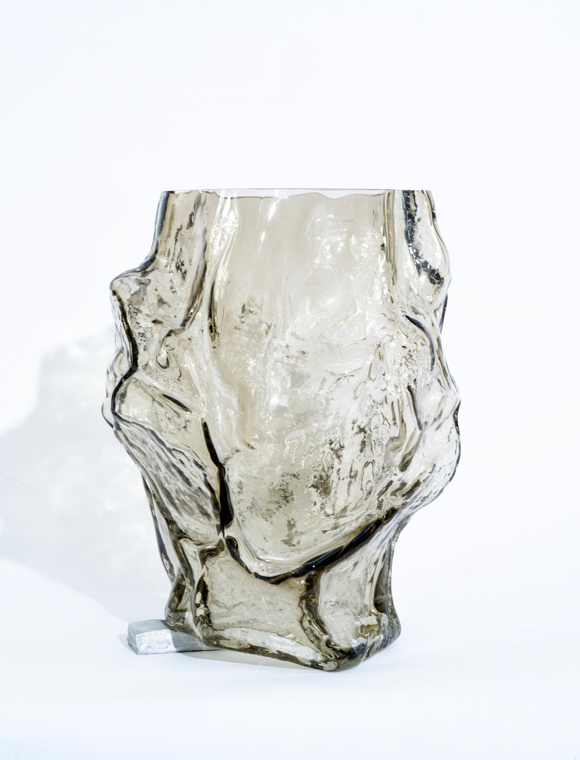 Moulded and then mouth blown glass, metal foot.

One of a kind

Measurements are approximate due to the form.

The Mountain vases by FOS embody the surface of the mountain, calibrated to the size of human interiors. FOS explains, “It’s limited