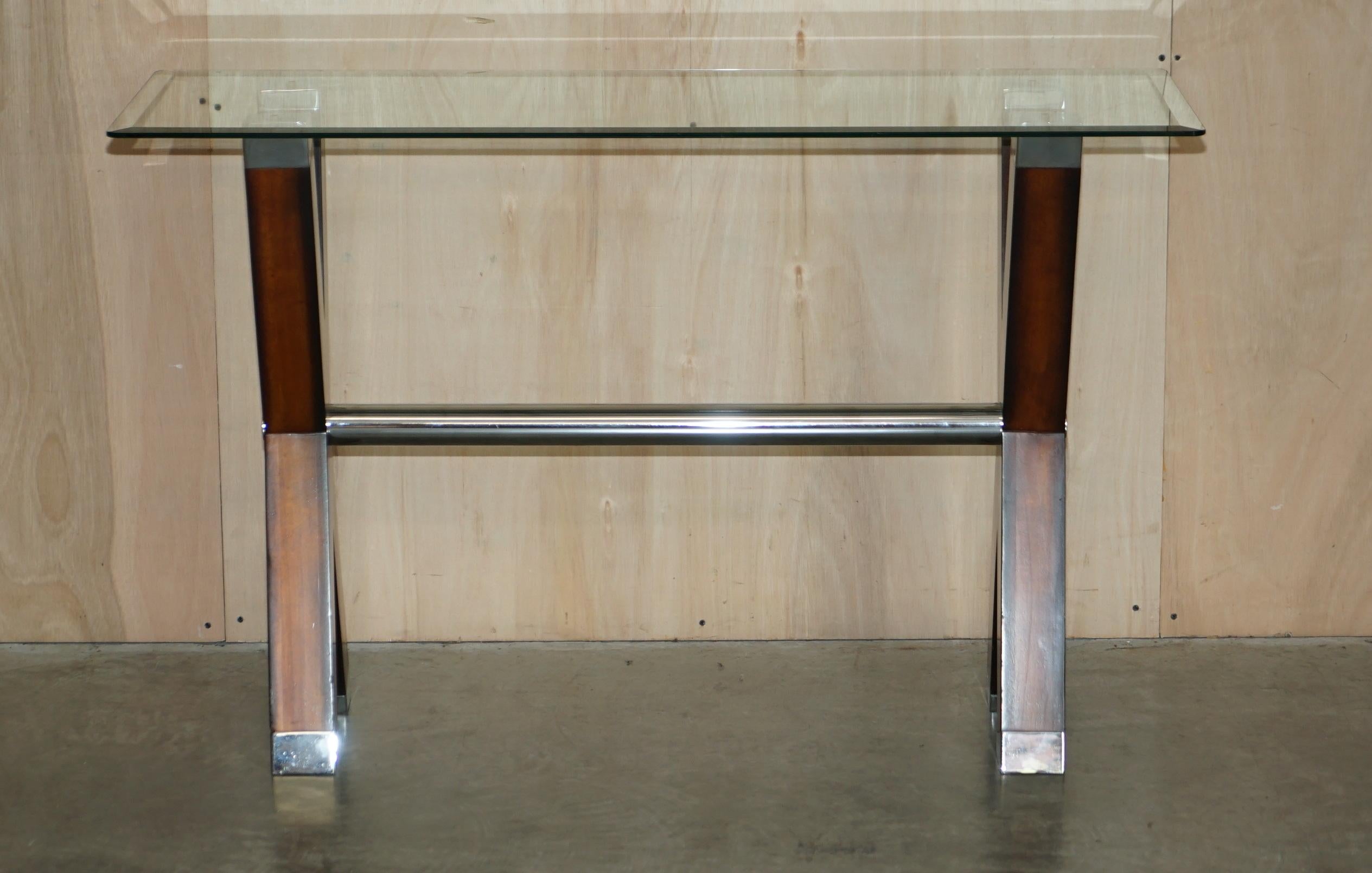 We are delighted to offer for sale this lovely, chrome tipped, x framed console table with bevelled edge glass top

A very good looking well made and decorative console or sofa table, the piece is decorated with chrome accents and looks amazing,