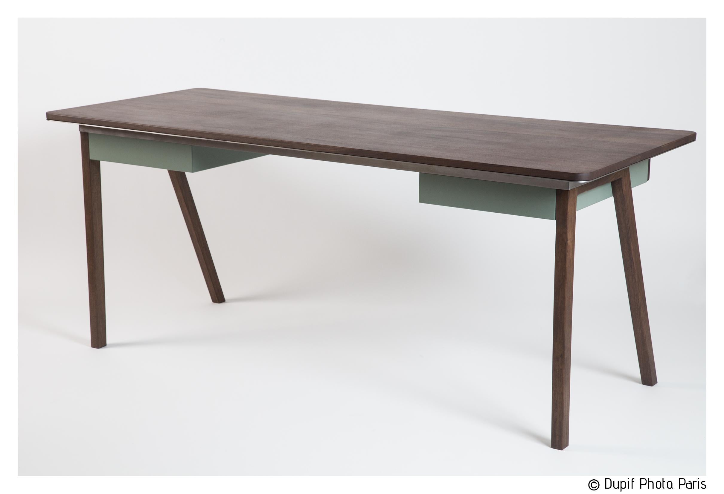 Sleek contemporary French walnut desk designed and created by Barnabé Richard as part of the Jean collection, paying tribute to Jean Prouvé. The design is decidedly modern. Handcrafted in France, the creator has chosen smooth walnut for its subtle