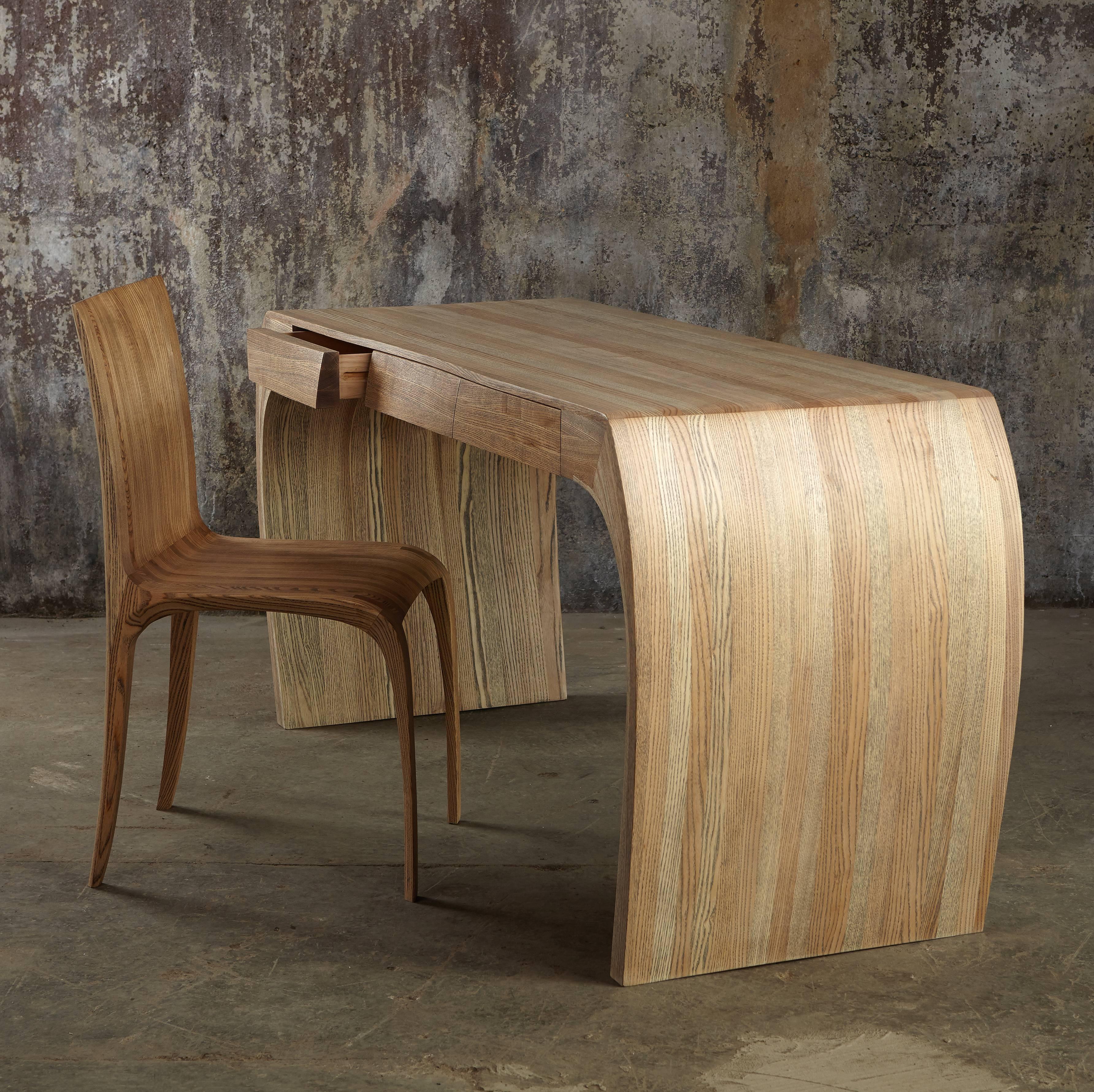 Steam bent solid ash, the finish is an ebony-stained grain and white oil finish. It is the number one of an edition of three. The drawers have tradition runners and a secret compartment!
The underside of the desk is as beautiful as the top with