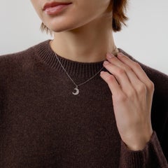 Contemporary diamond 18k white gold half-moon necklace