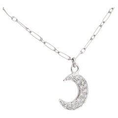 Contemporary diamond 18k white gold half-moon necklace