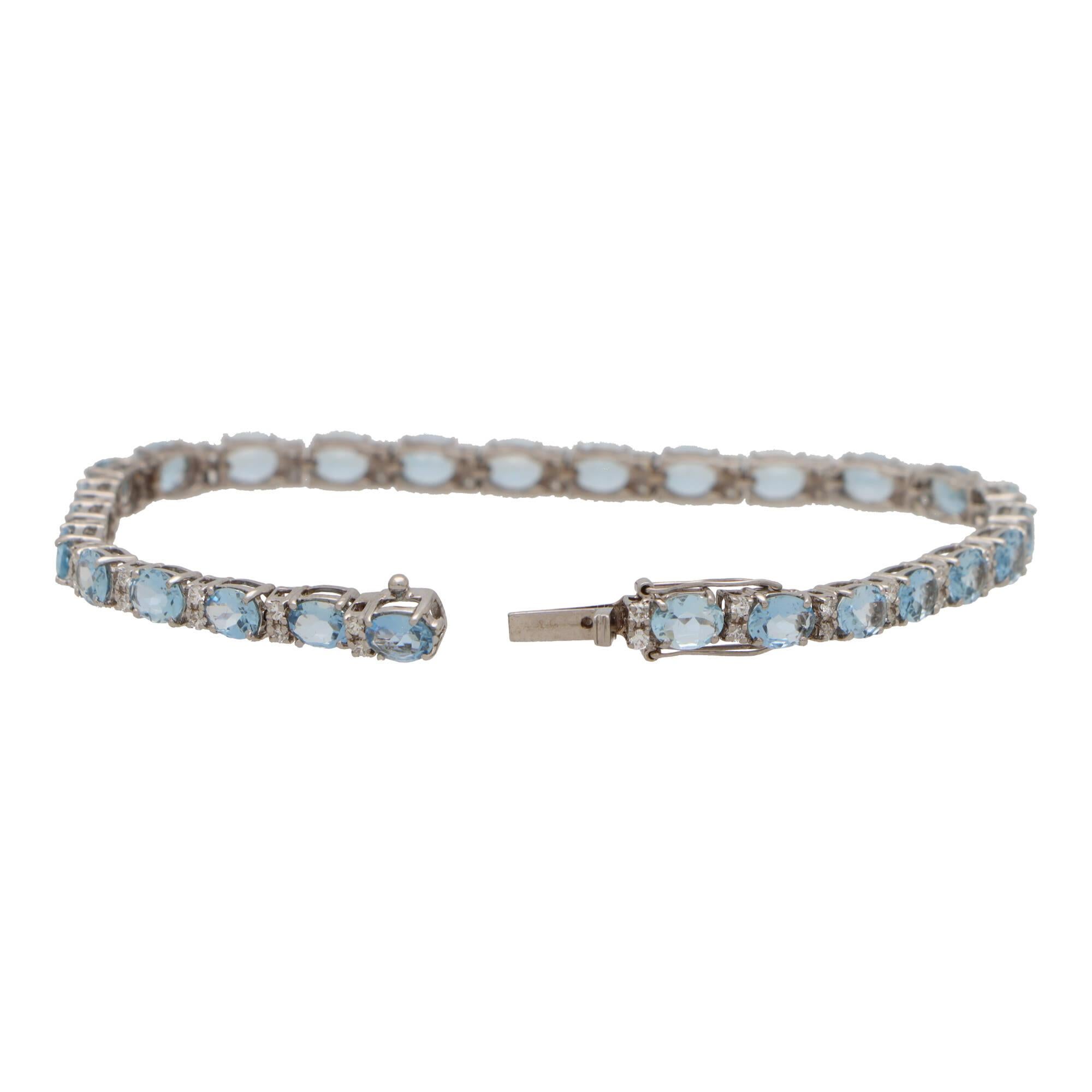 A beautiful contemporary diamond and aquamarine bracelet set in 18k white gold.

The bracelet is composed of a grand total of 27 oval cut aquamarines and 54 round brilliant cut diamonds. All of the stones are securely claw set and alternate between